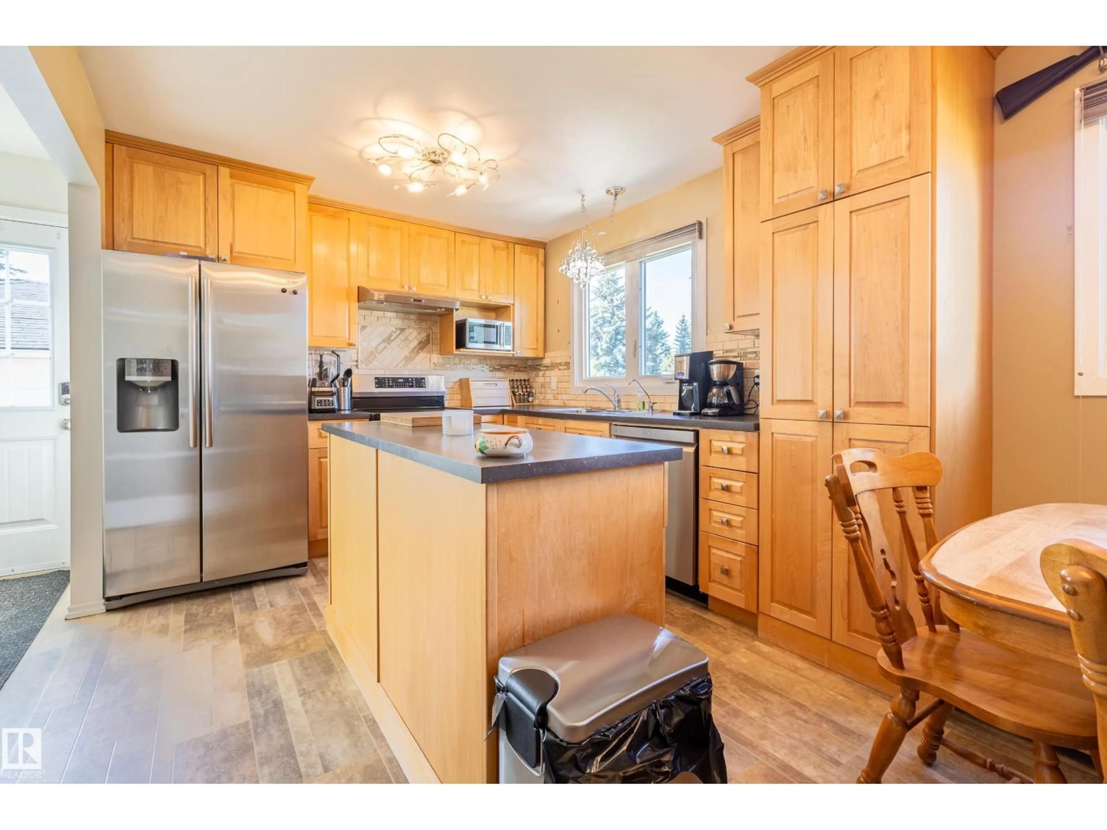Open concept kitchen, wood/laminate floor for 4831 54 ST, Redwater Alberta T0A2W0