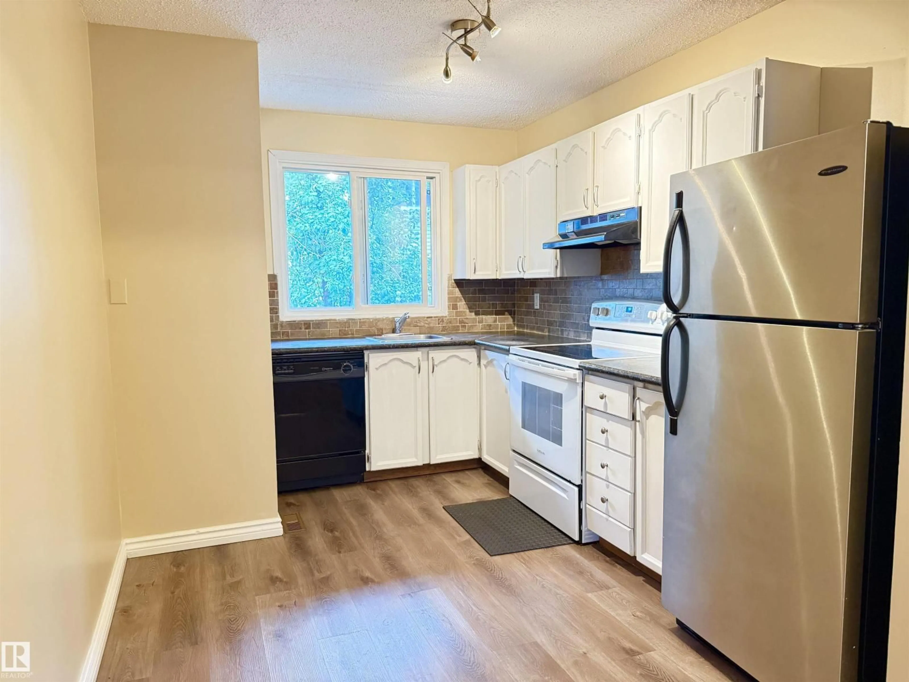 Standard kitchen, wood/laminate floor for NW - 11805 32A AV, Edmonton Alberta T6J5K8