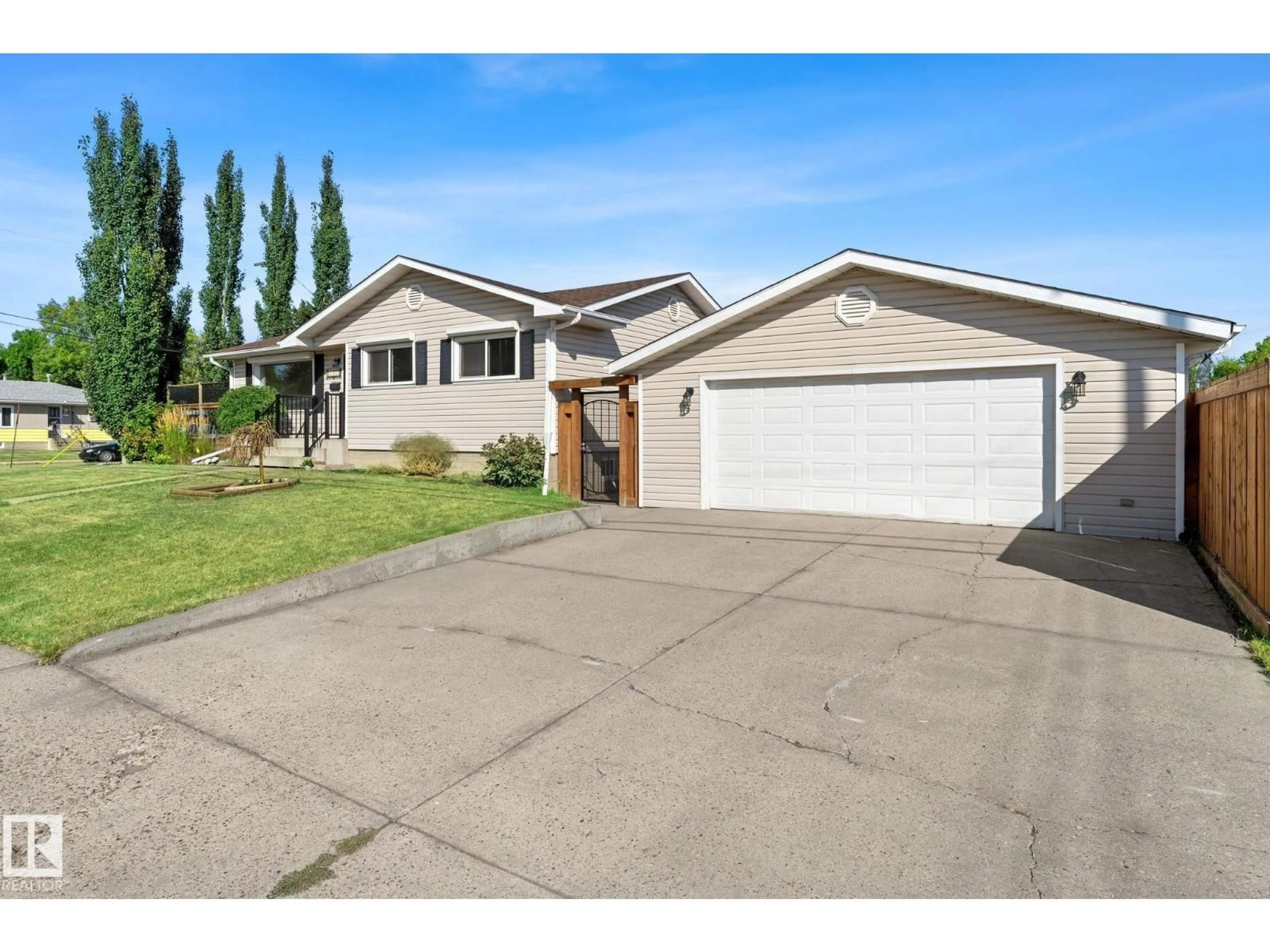 Home with vinyl exterior material, street for 11507 48 ST, Edmonton Alberta T5W2Y1