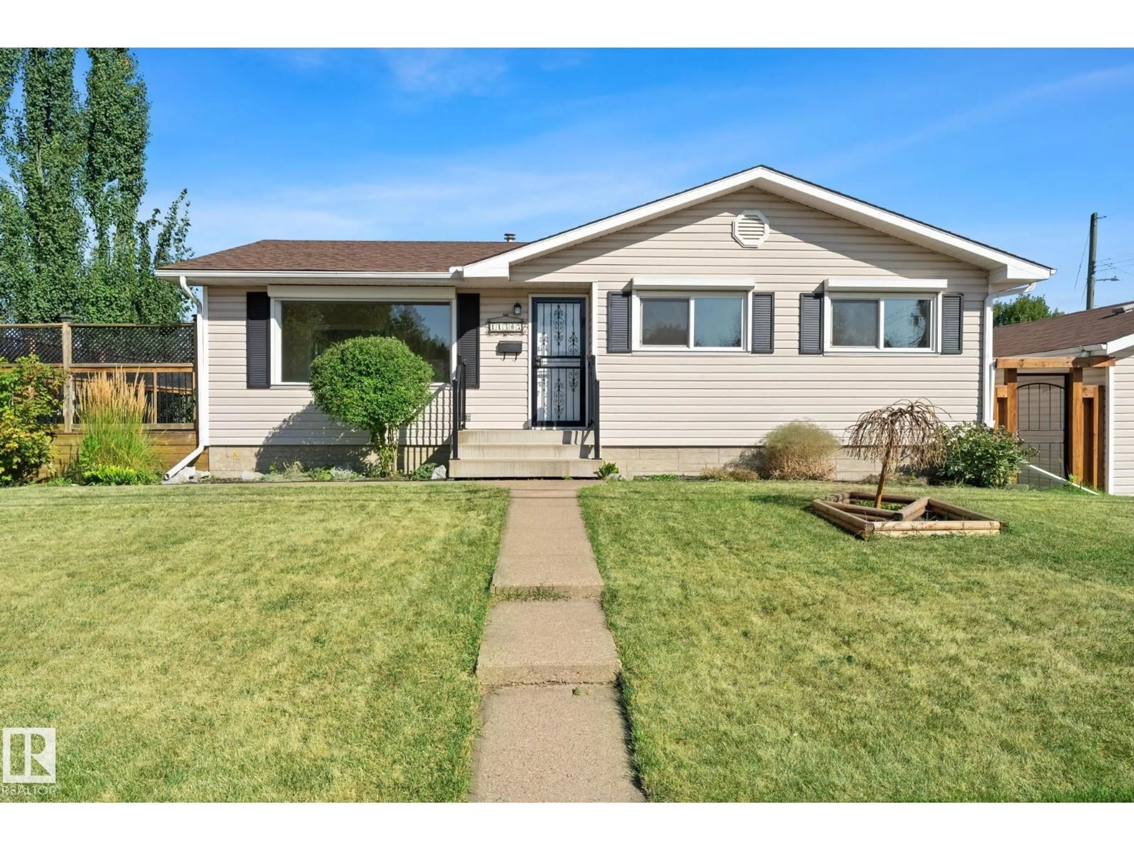 Home with vinyl exterior material, street for 11507 48 ST, Edmonton Alberta T5W2Y1