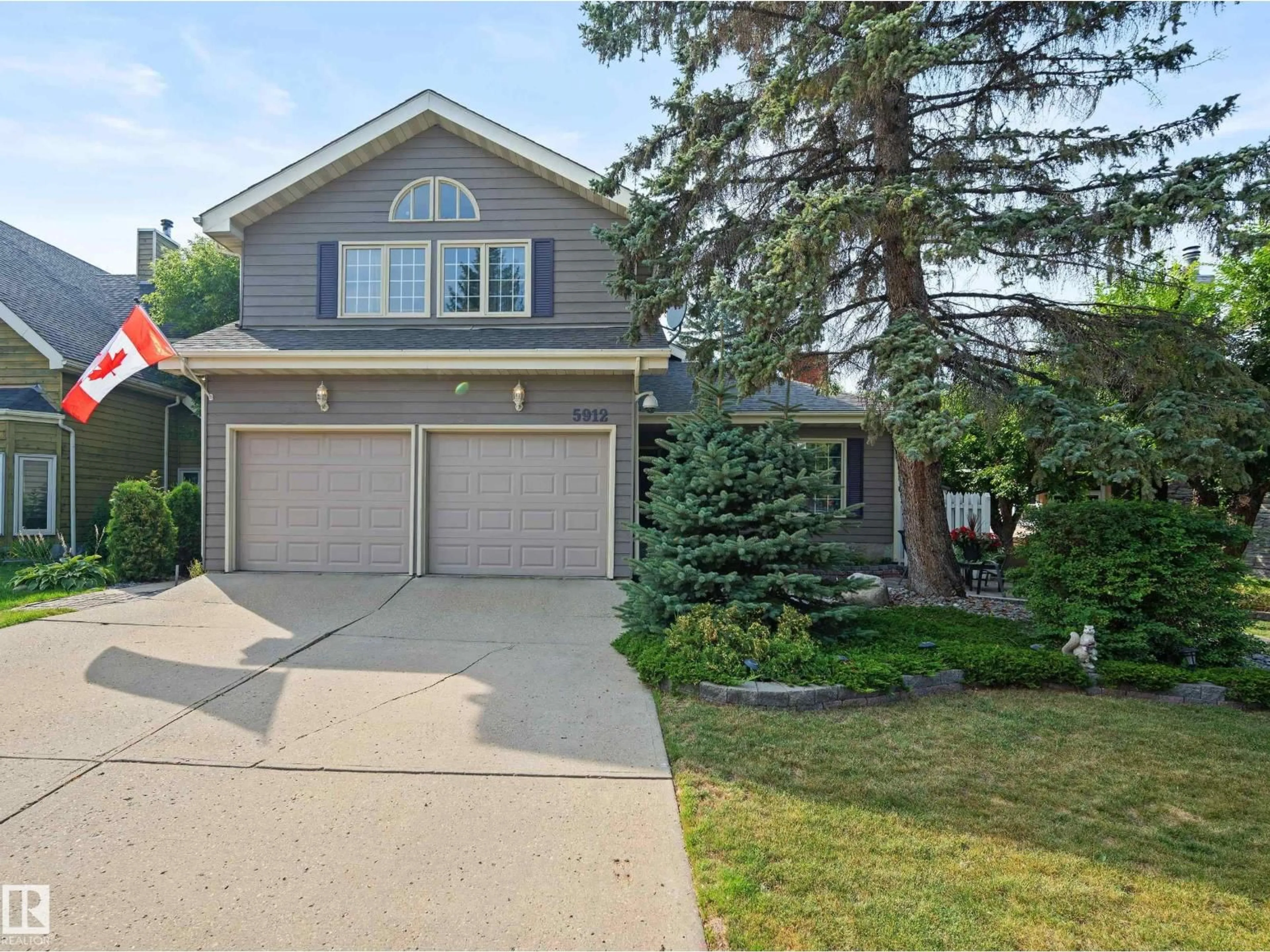 Home with vinyl exterior material, street for NW - 5912 177 ST, Edmonton Alberta T6M1H8