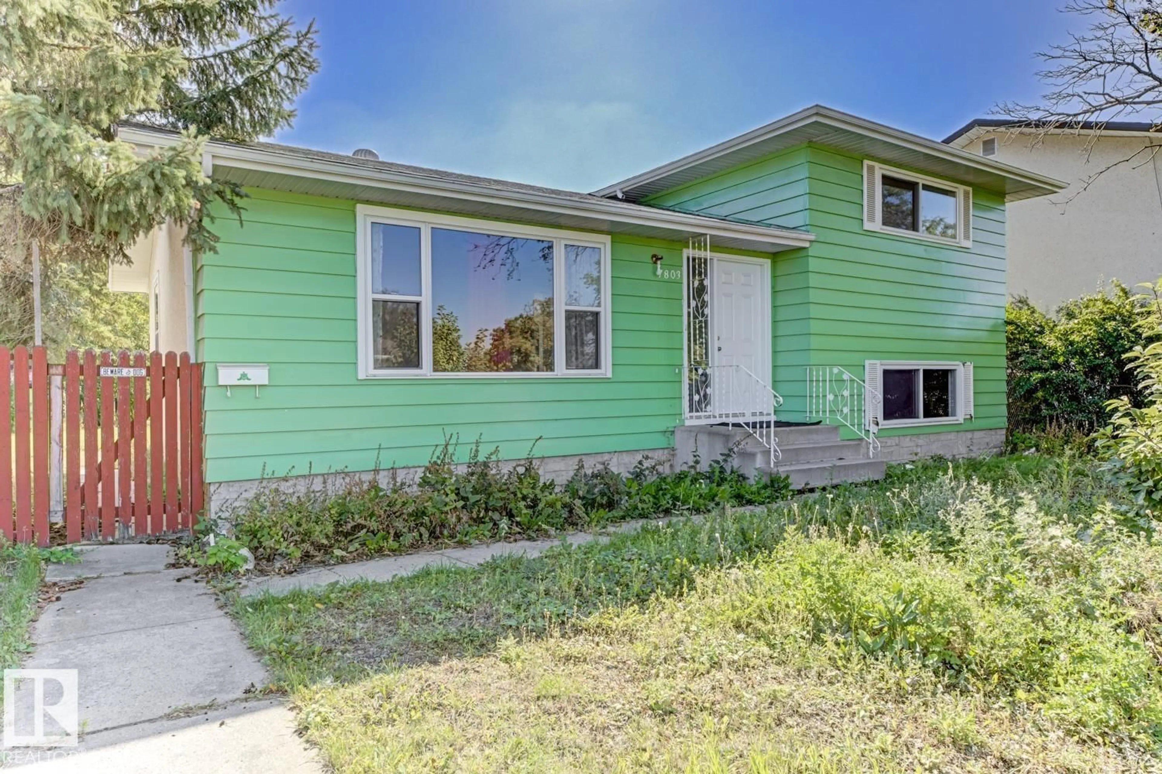 Home with vinyl exterior material, street for 7803 141 AV, Edmonton Alberta T5C2N4