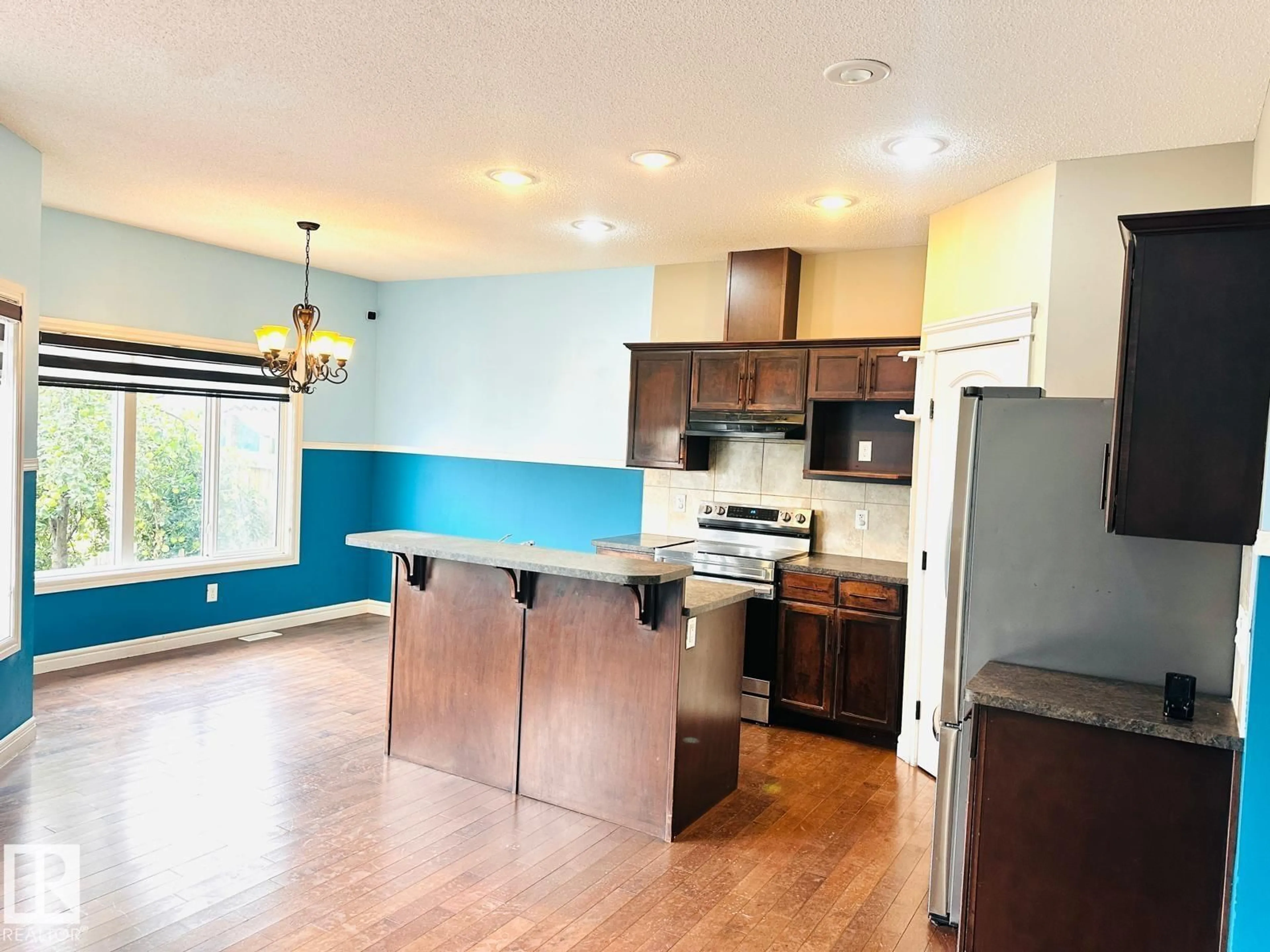 Open concept kitchen, wood/laminate floor for 2825 16A AV, Edmonton Alberta T6T0T7