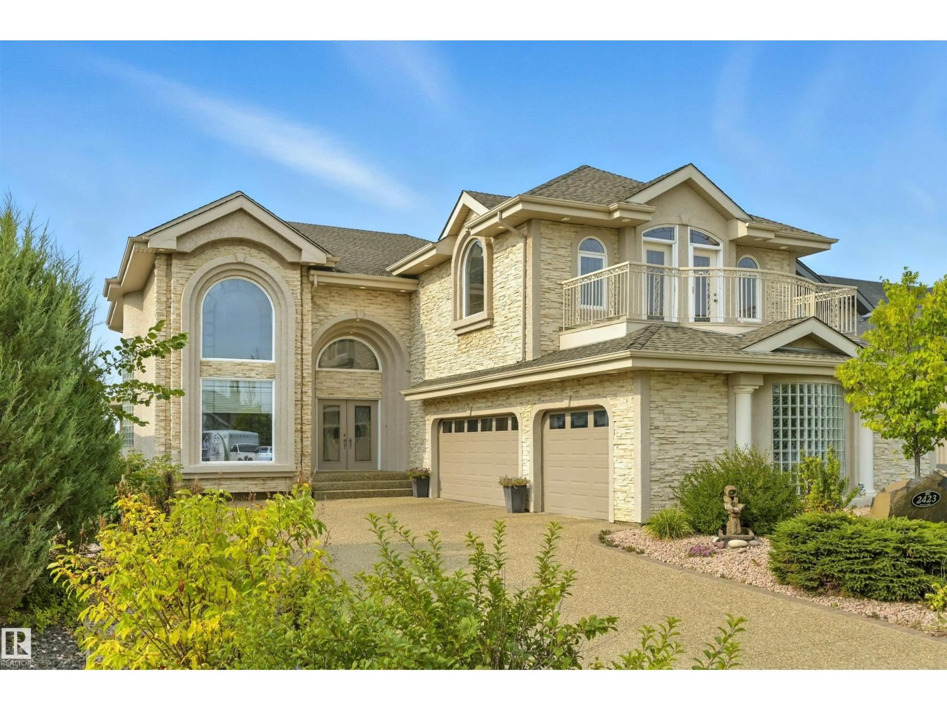 Home with vinyl exterior material, street for 2423 TEGLER GR, Edmonton Alberta T6R3K2