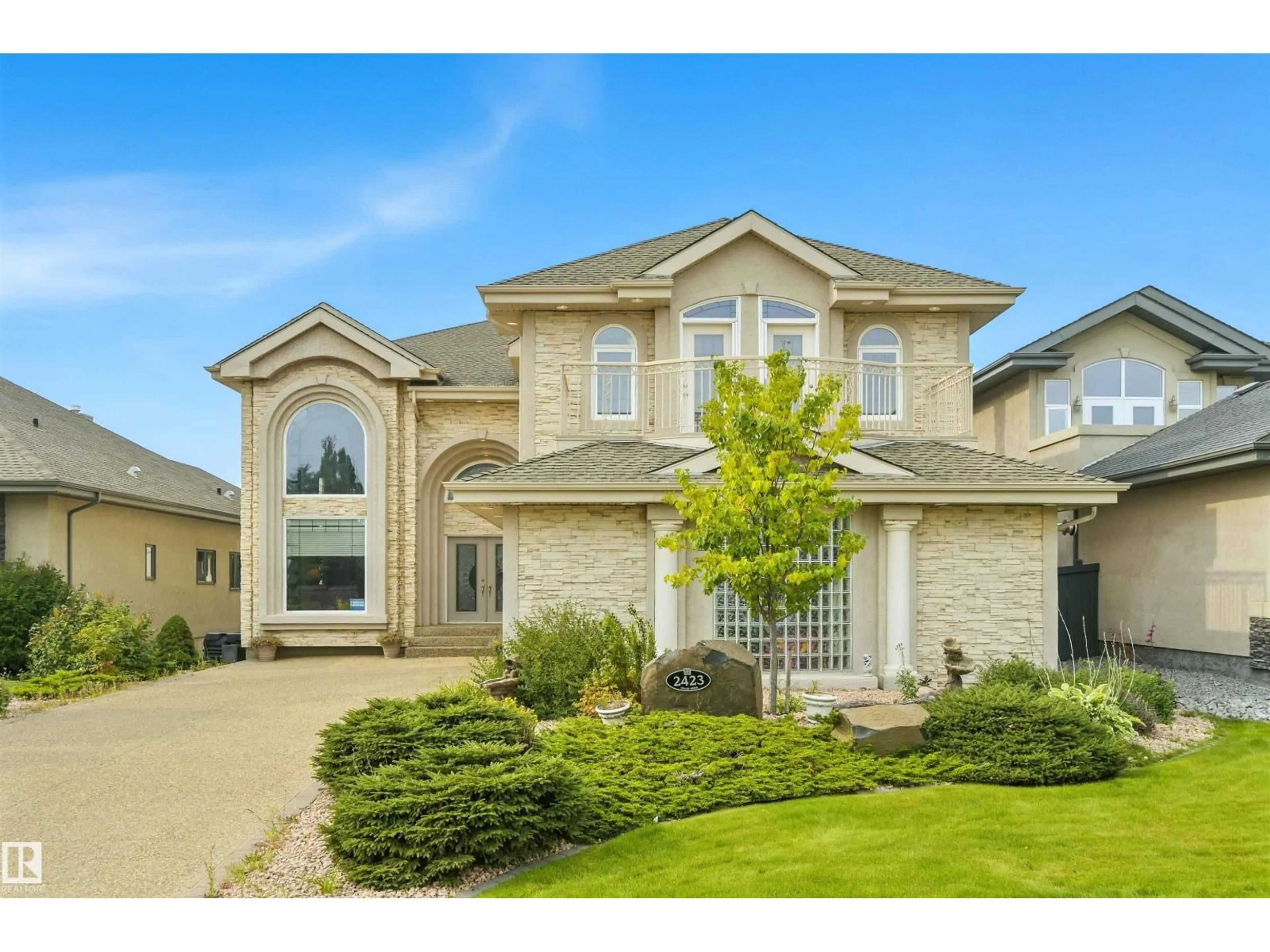 Home with vinyl exterior material, street for 2423 TEGLER GR, Edmonton Alberta T6R3K2