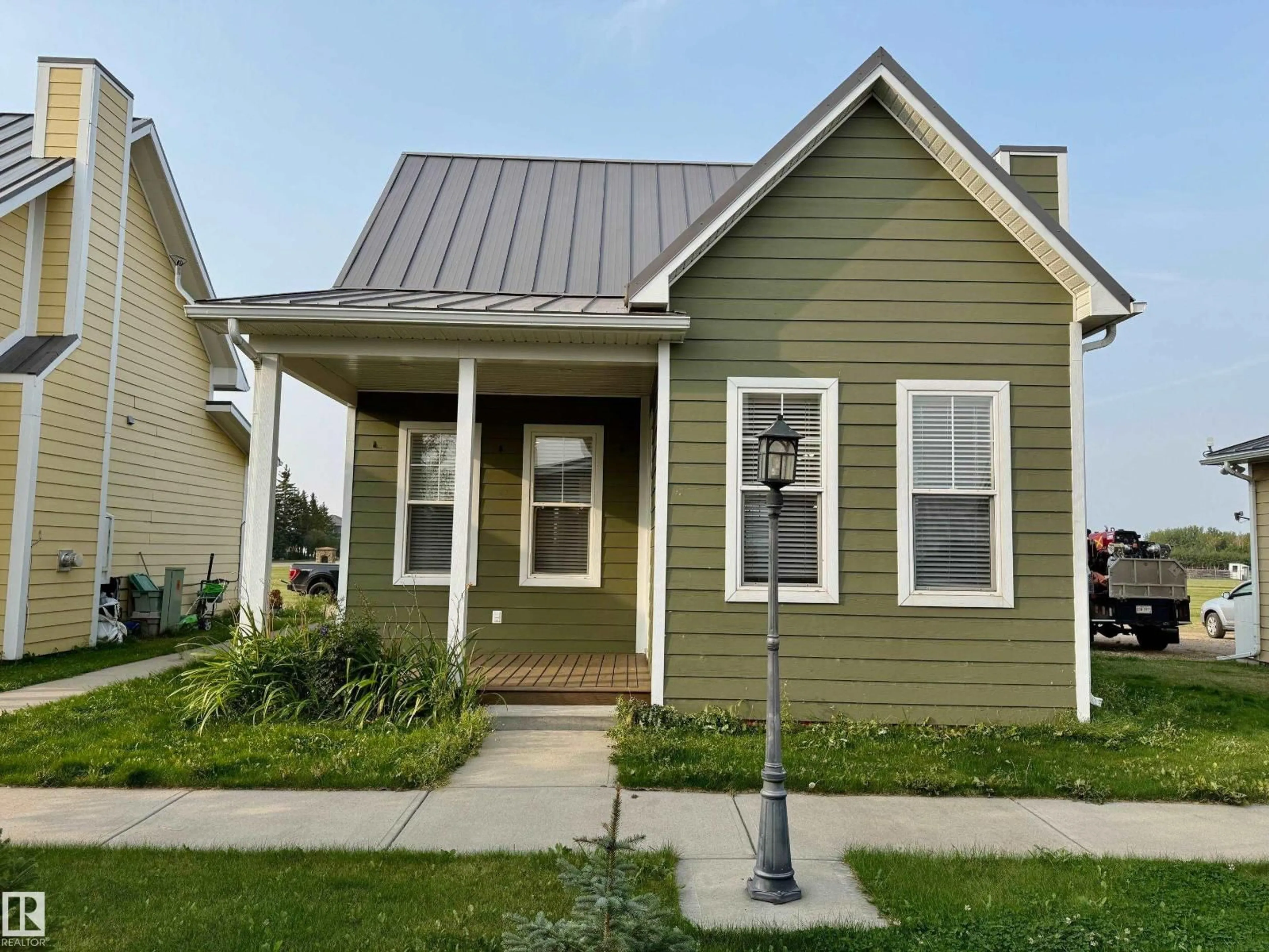 Home with vinyl exterior material, street for 4904 51 ST, Chipman Alberta T0B0W0