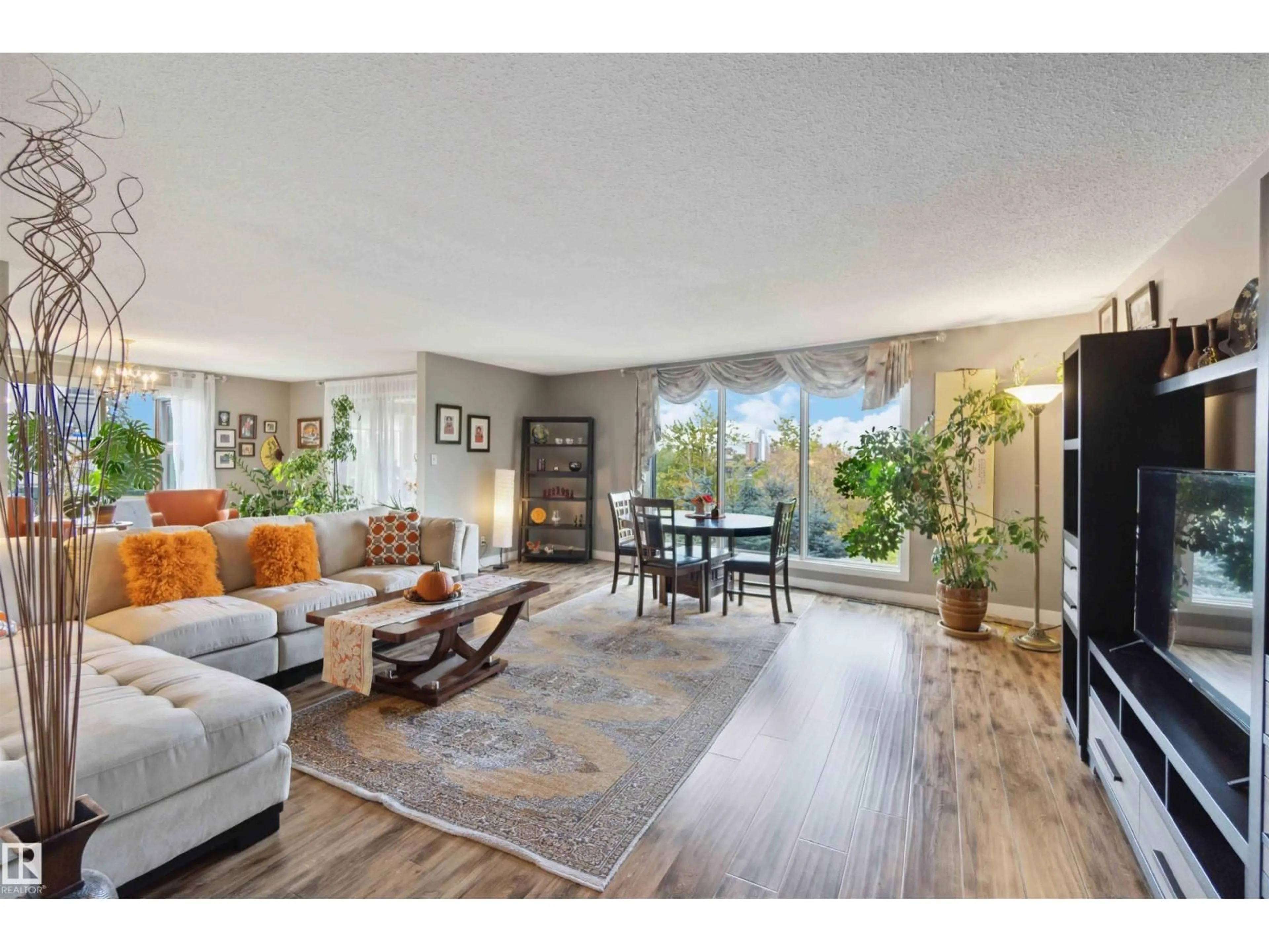 Living room with furniture, wood/laminate floor for NW - 8707 107 ST, Edmonton Alberta T6E5J5