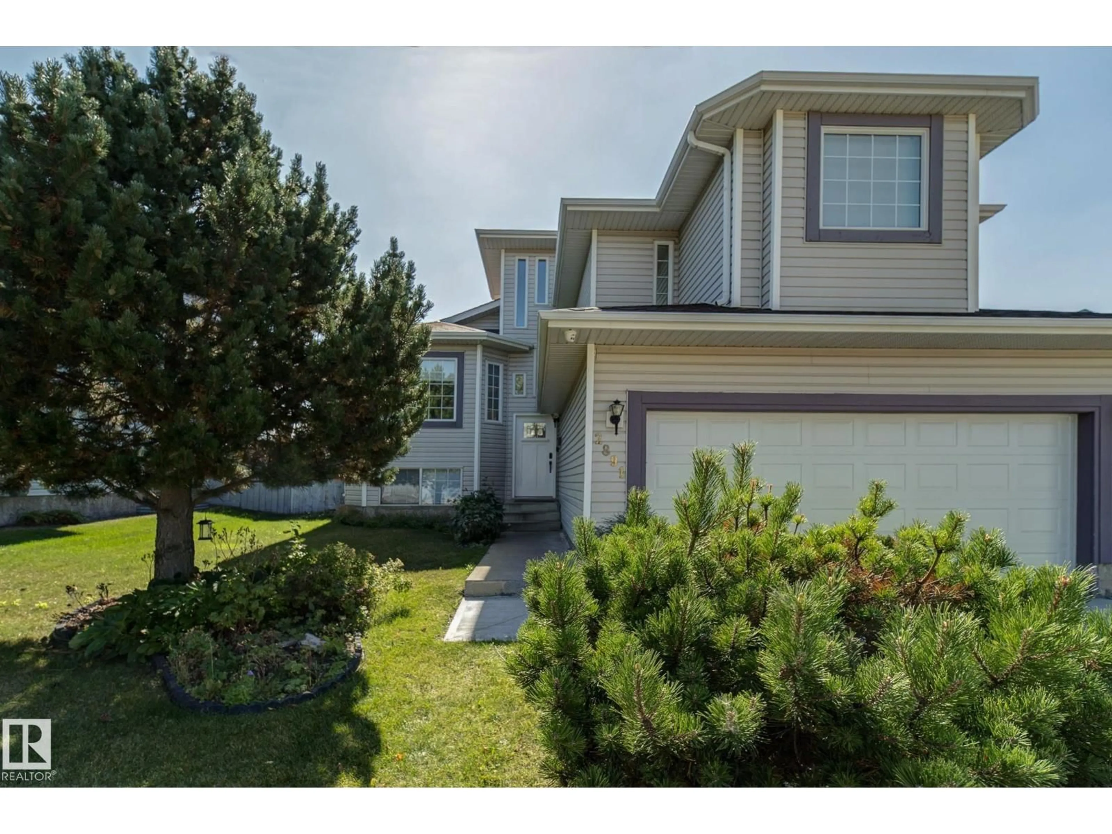 Home with vinyl exterior material, street for 2891 37A AV NW, Edmonton Alberta T6T1H7