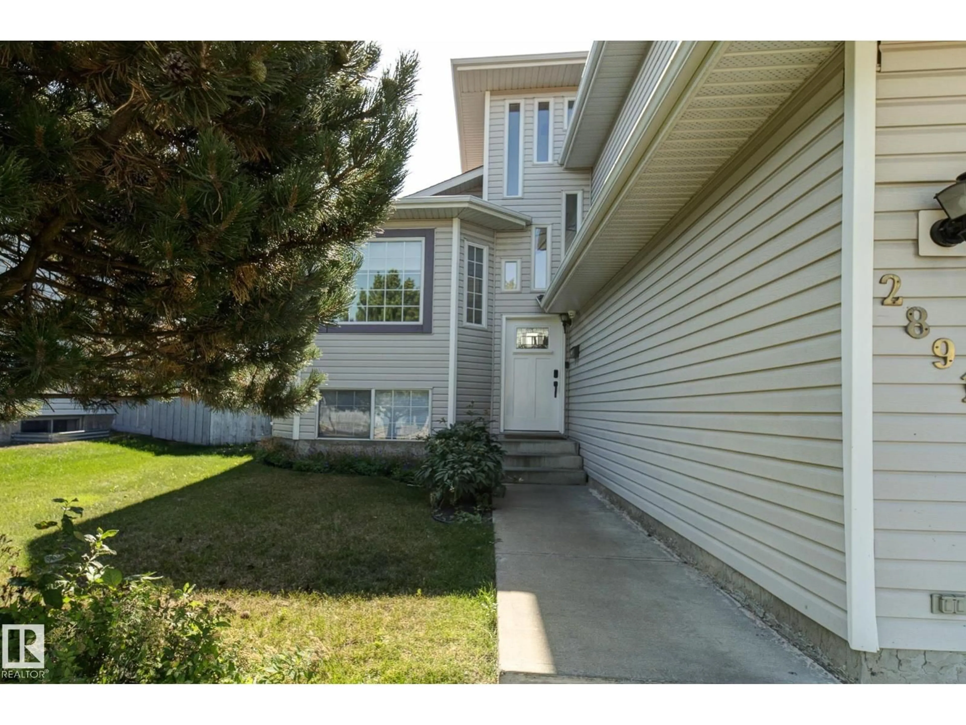 Home with vinyl exterior material, street for 2891 37A AV NW, Edmonton Alberta T6T1H7
