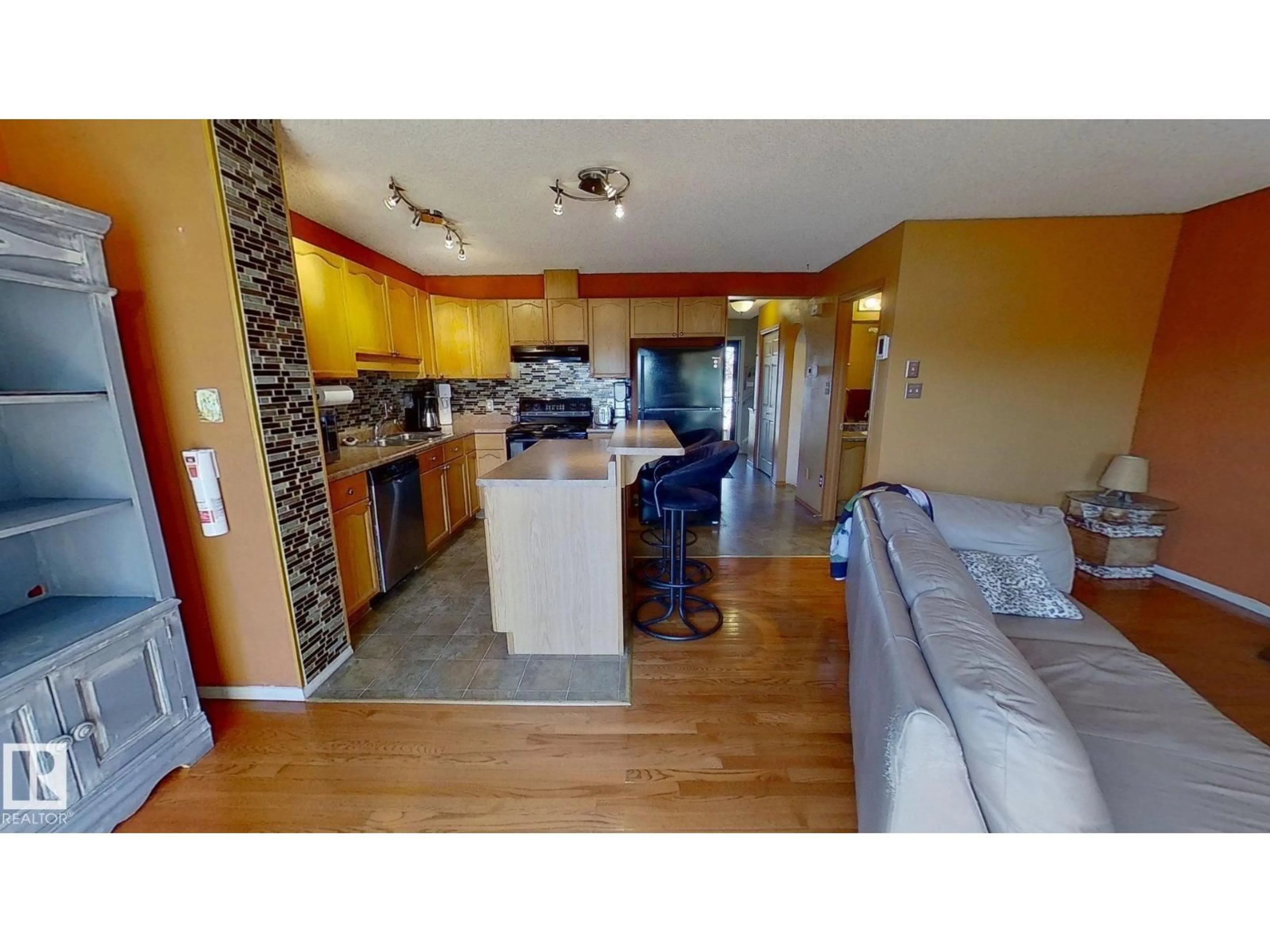 Open concept kitchen, wood/laminate floor for 2927 30 ST, Edmonton Alberta T6T1V2