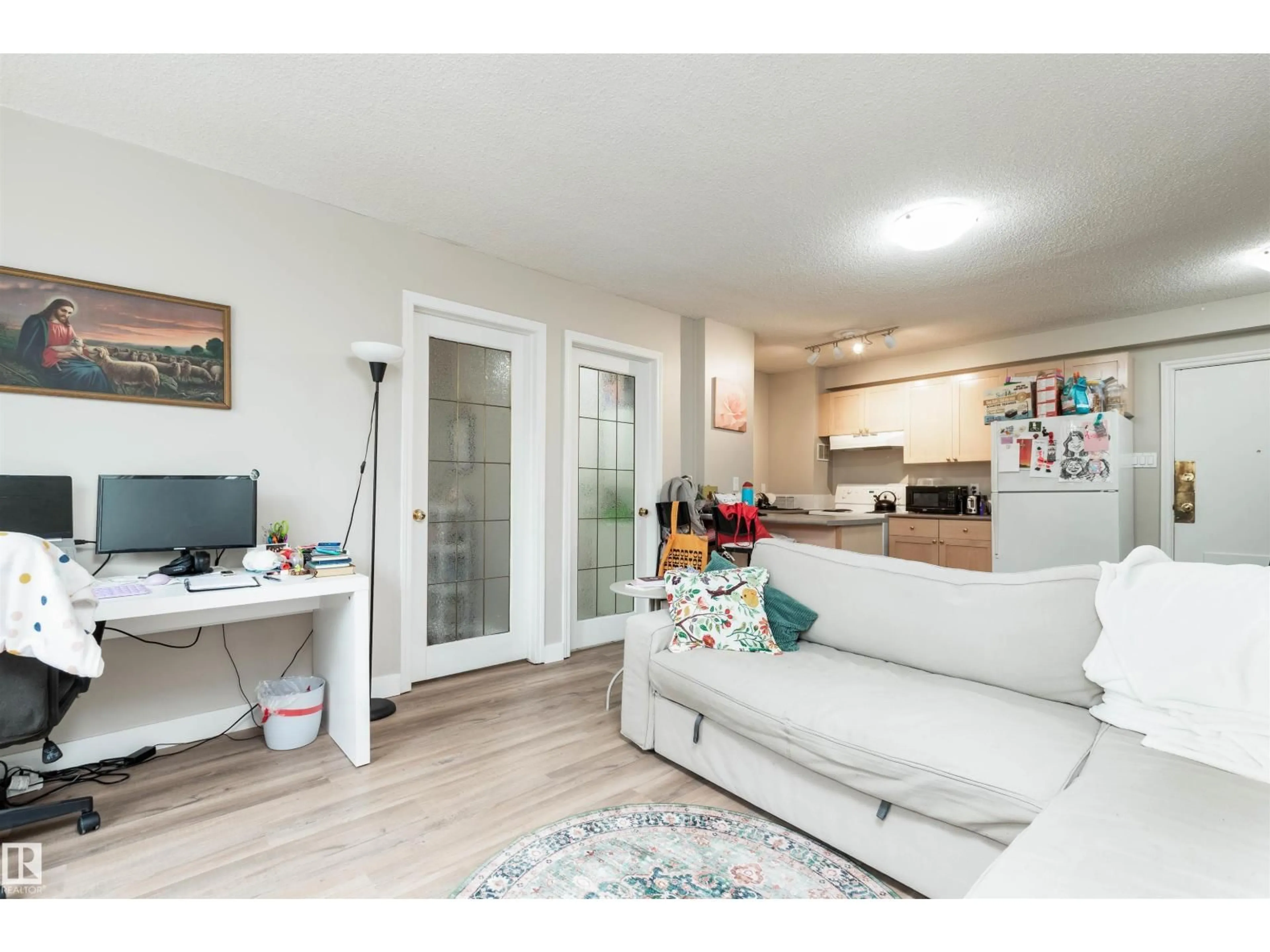 Living room with furniture, wood/laminate floor for 205 - 9730 106 ST, Edmonton Alberta T5K1B7