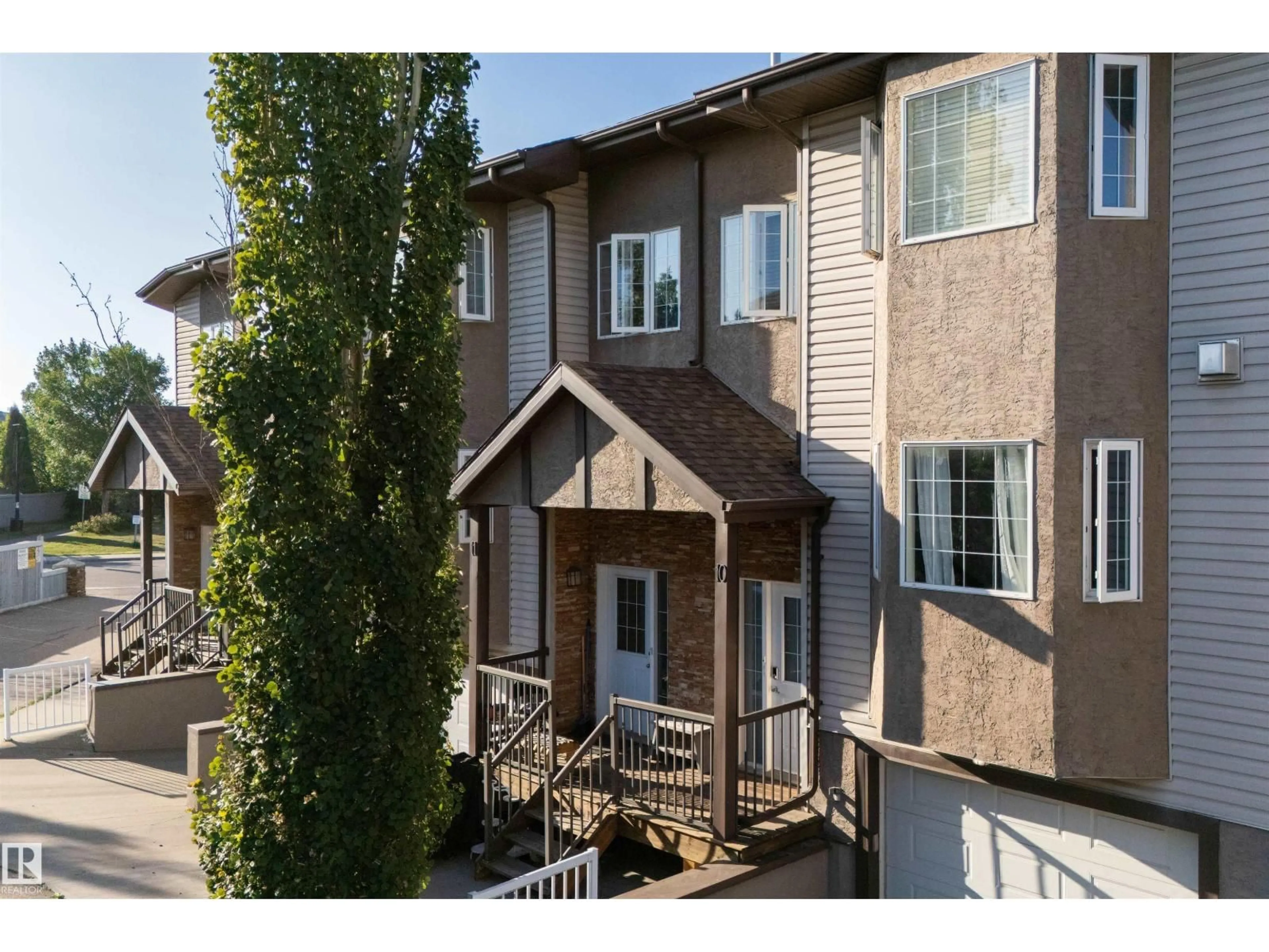 A pic from outside/outdoor area/front of a property/back of a property/a pic from drone, street for 10 - 17839 99 ST NW, Edmonton Alberta T5X6A6