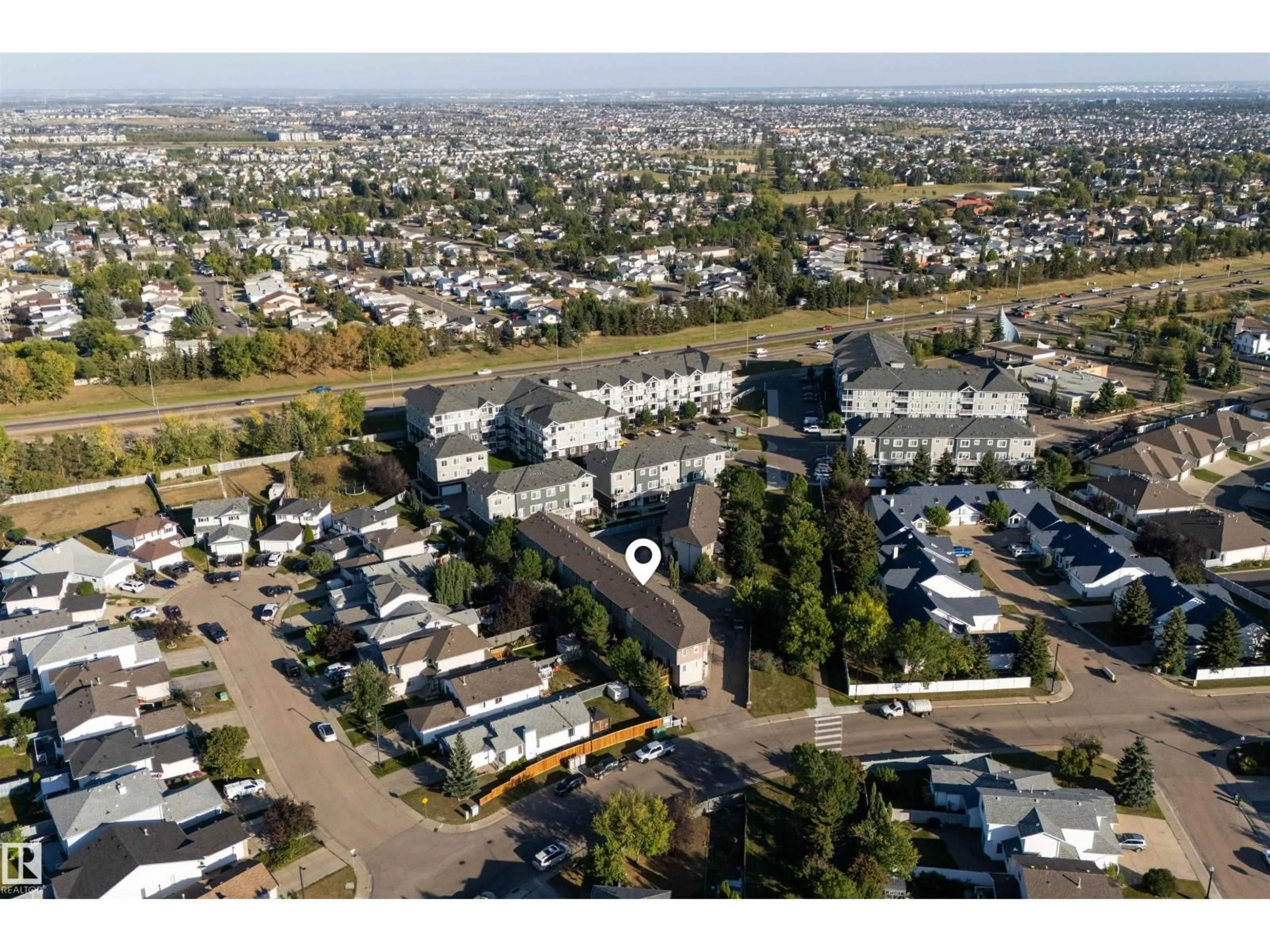 A pic from outside/outdoor area/front of a property/back of a property/a pic from drone, street for 10 - 17839 99 ST NW, Edmonton Alberta T5X6A6