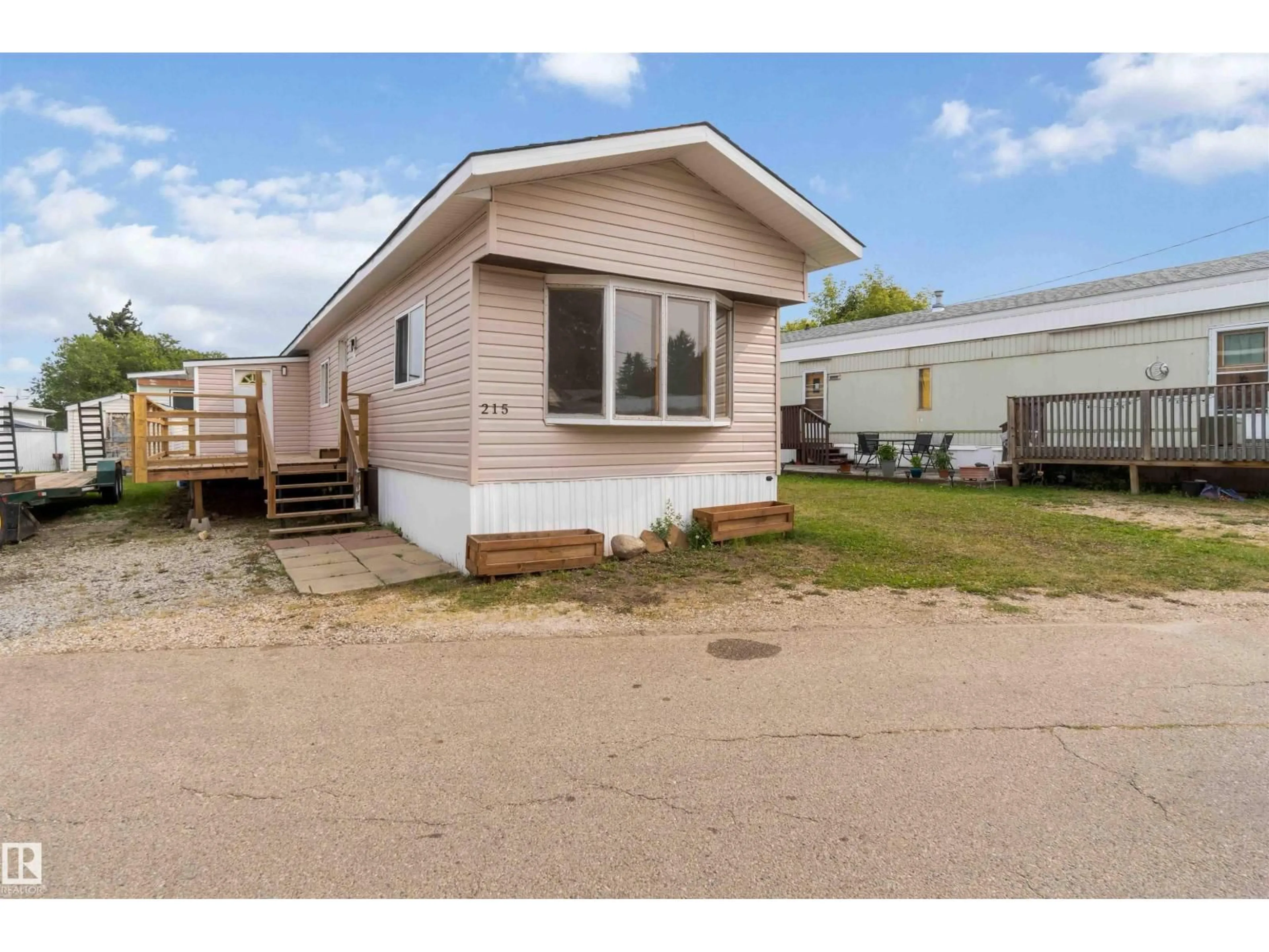 Home with vinyl exterior material, street for 215 - 305 CALAHOO RD, Spruce Grove Alberta T7X3L1
