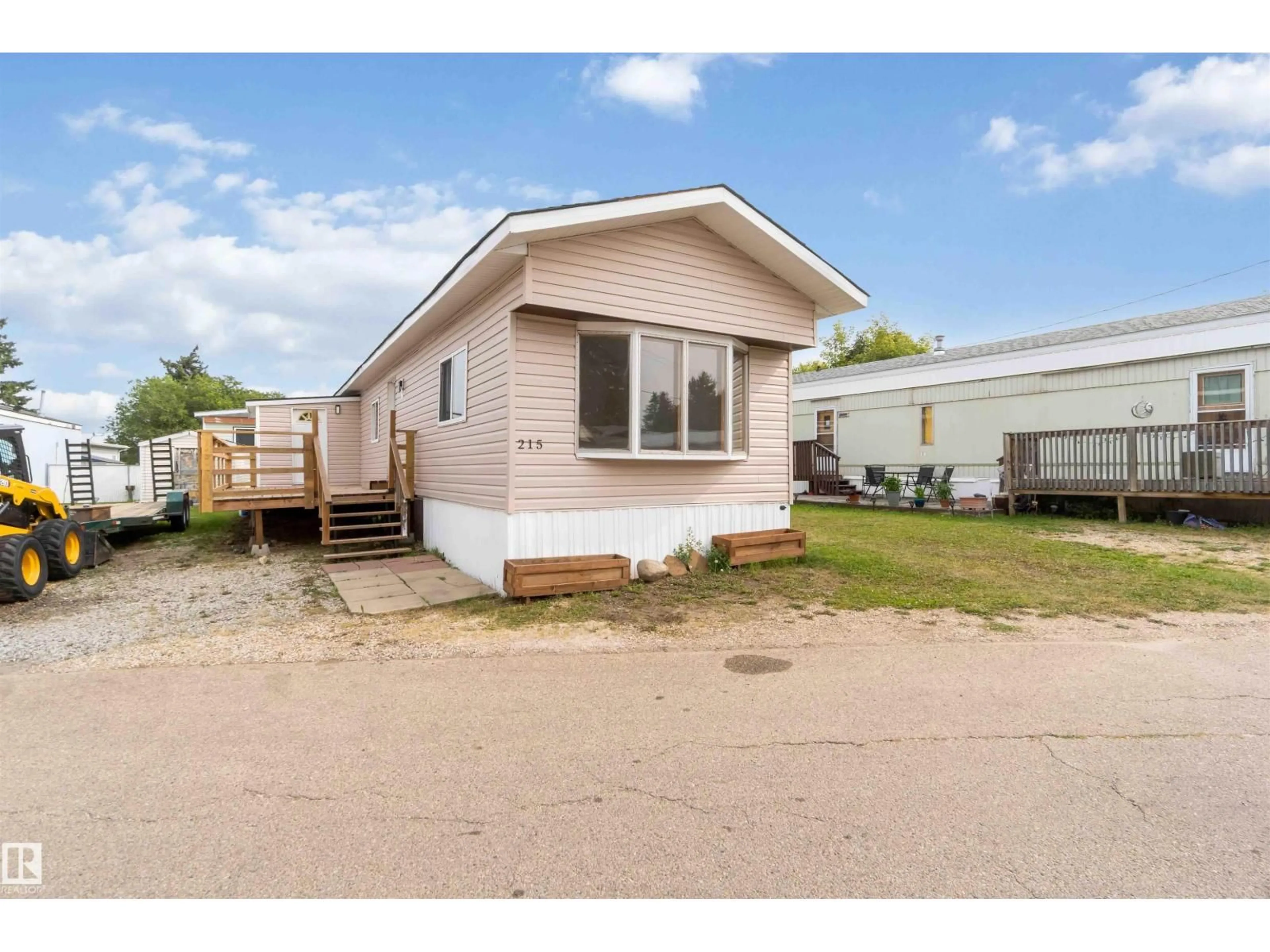 Home with vinyl exterior material, street for 215 - 305 CALAHOO RD, Spruce Grove Alberta T7X3L1