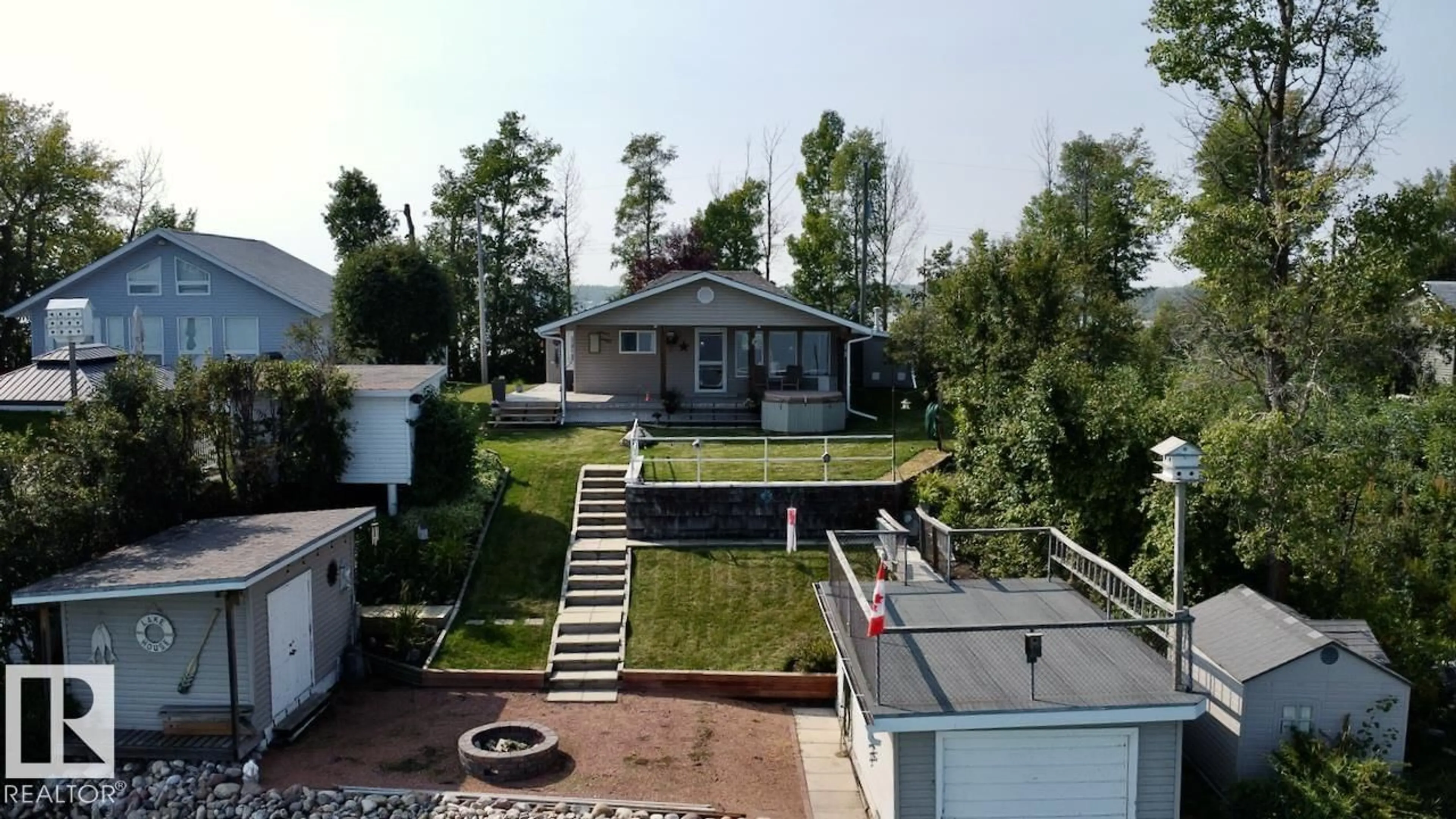 A pic from outside/outdoor area/front of a property/back of a property/a pic from drone, street for 37 - 5427 HWY 633 HWY, Rural Lac Ste. Anne County Alberta T0E0L0