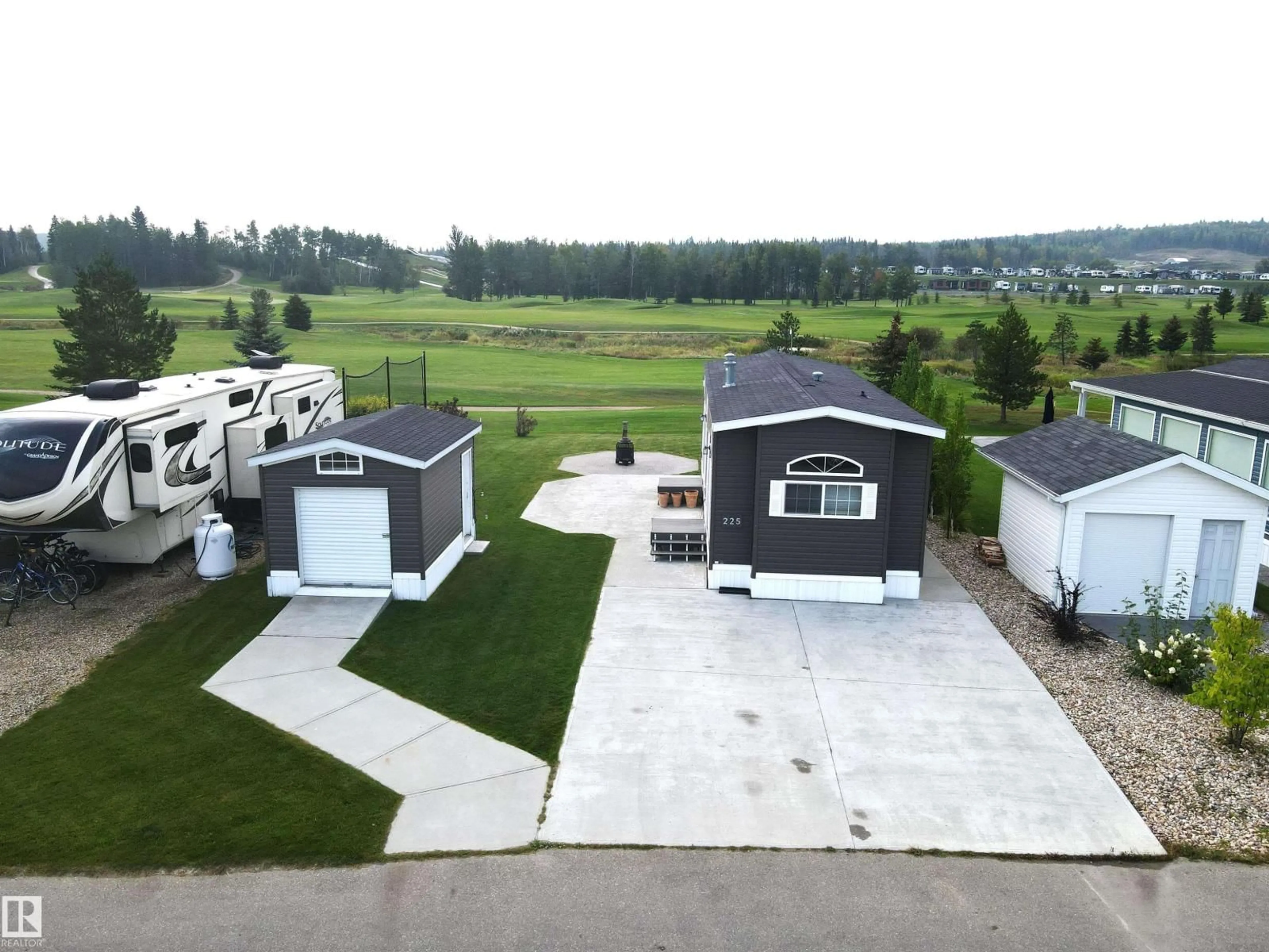 A pic from outside/outdoor area/front of a property/back of a property/a pic from drone, unknown for 225 53126 RANGE ROAD 70, Rural Parkland County Alberta T0E0W0