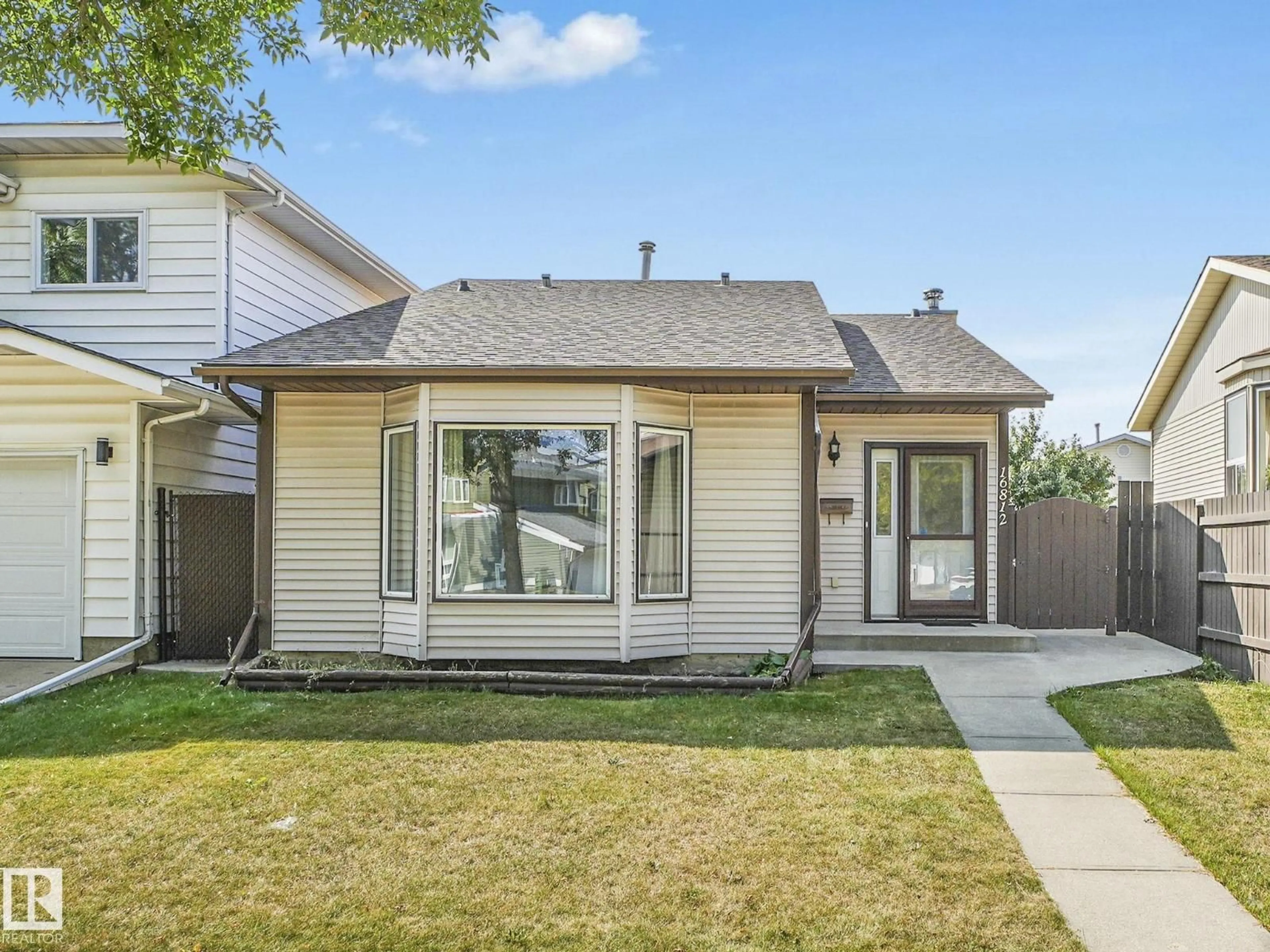 Home with vinyl exterior material, street for 16812 95 ST, Edmonton Alberta T5Z1Y4