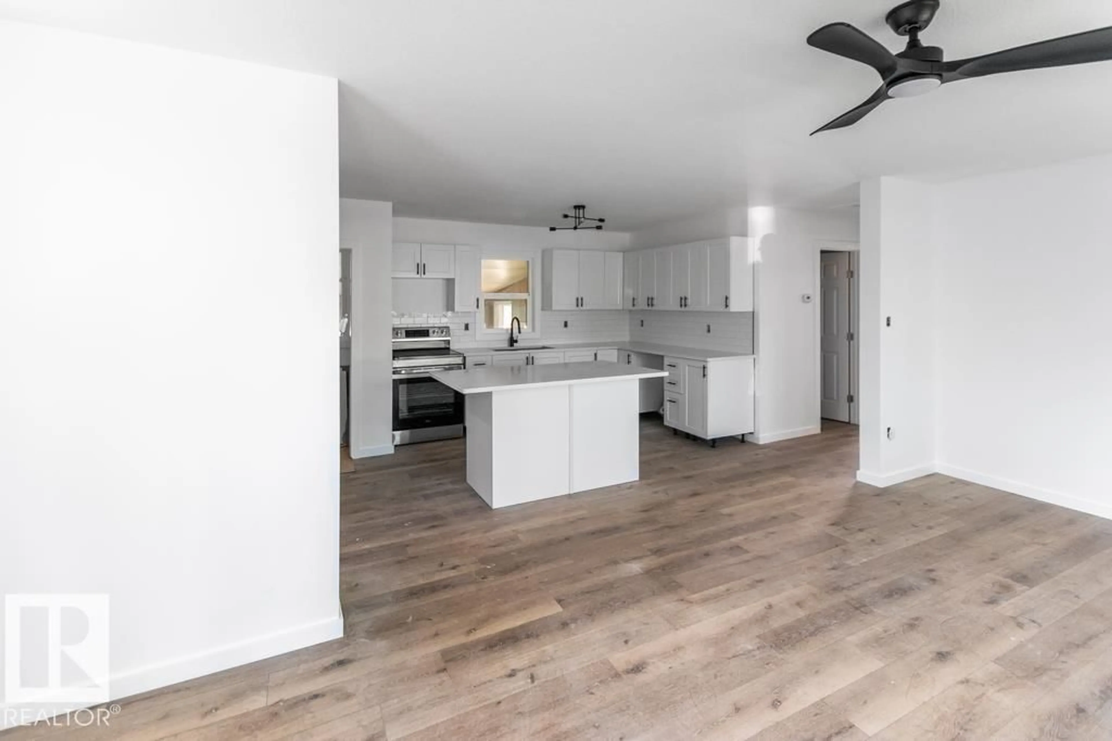Open concept kitchen, wood/laminate floor for 5306 51 AV, Bonnyville Town Alberta T9N2A7