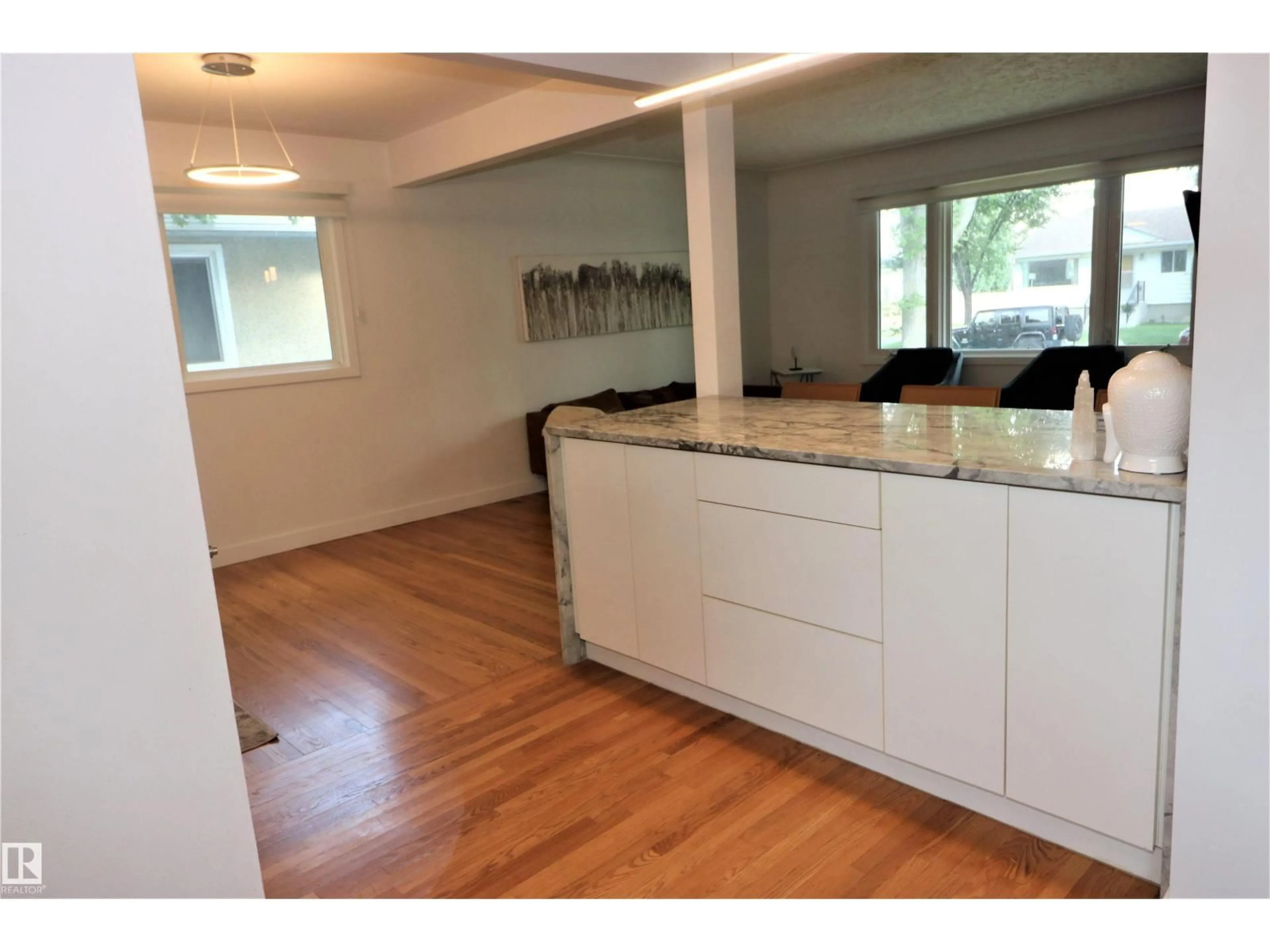 Open concept kitchen, wood/laminate floor for 8528 64 AV, Edmonton Alberta T6E0H3
