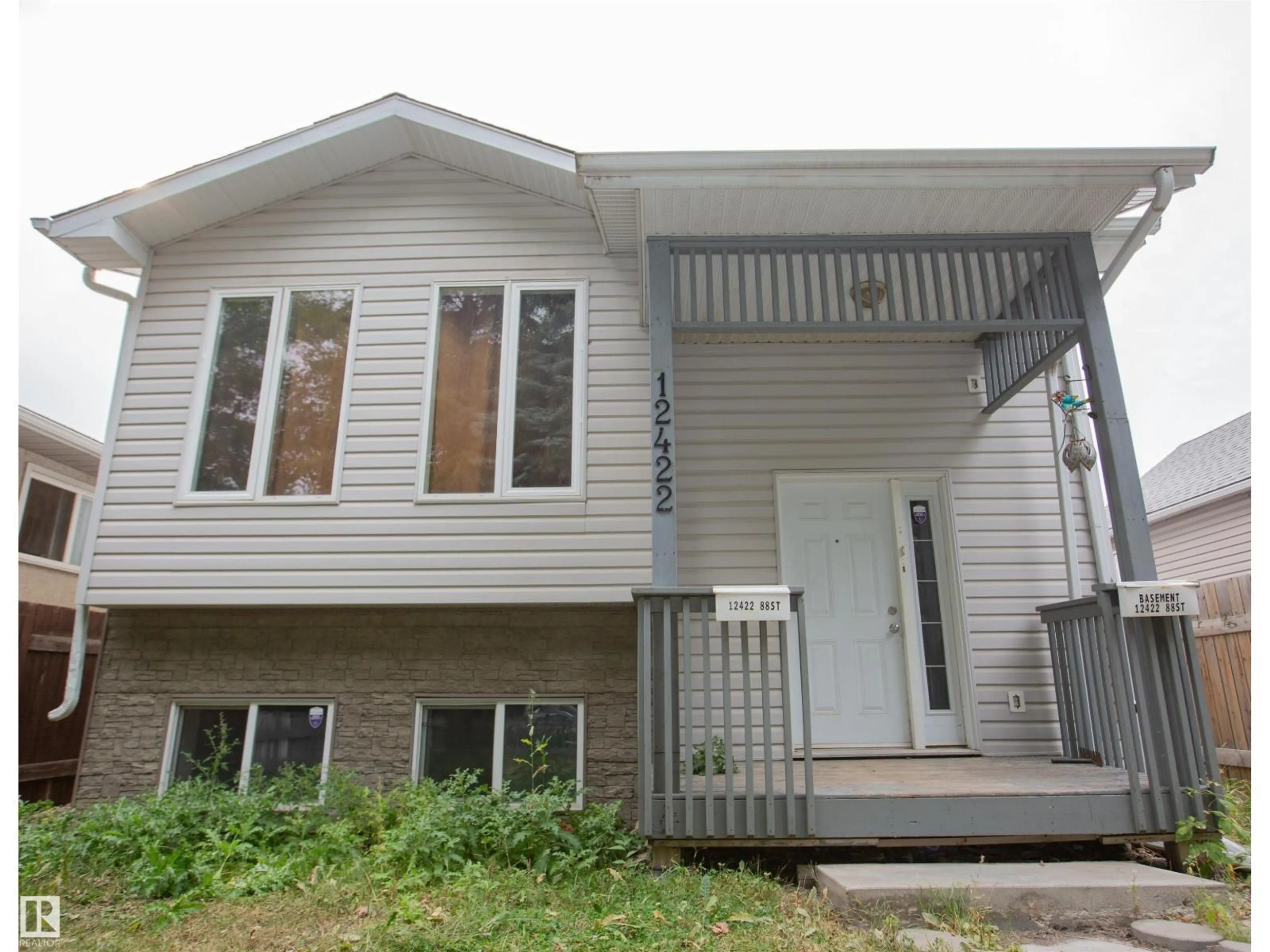 Home with vinyl exterior material, street for 12422 88 ST, Edmonton Alberta T5B3T2