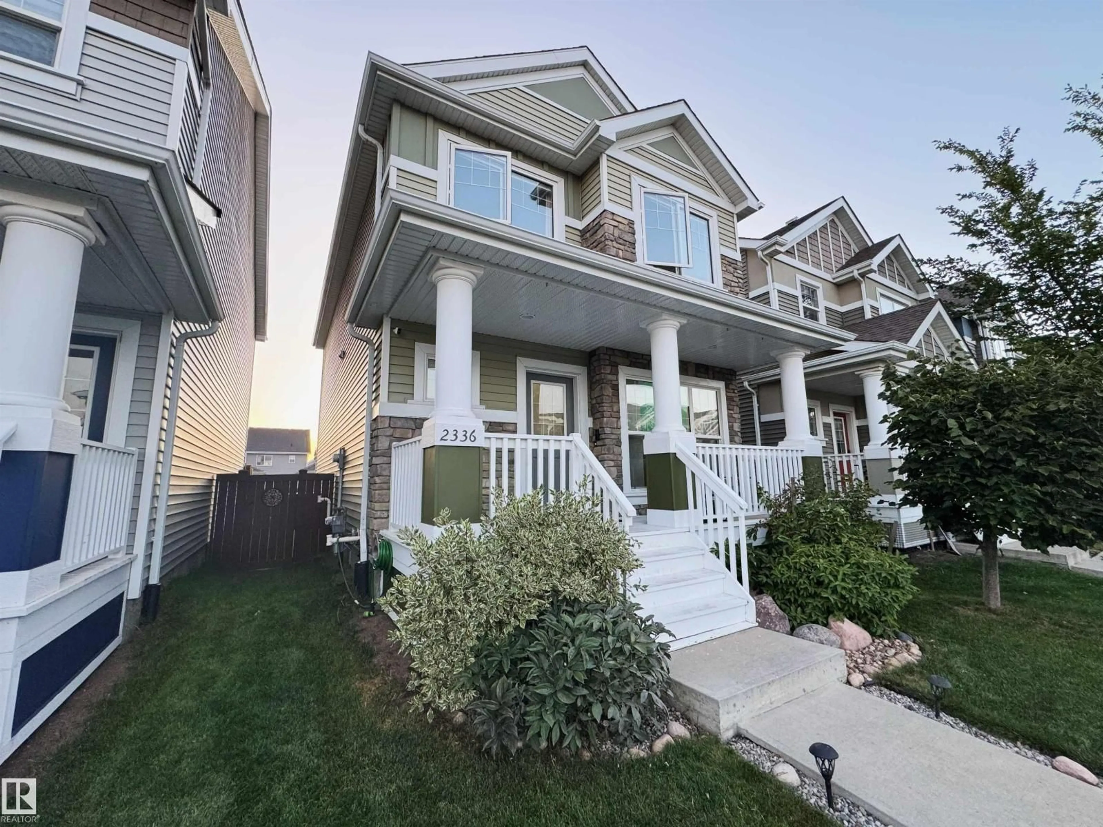 Home with vinyl exterior material, street for 2336 70 ST, Edmonton Alberta T6X1Z2