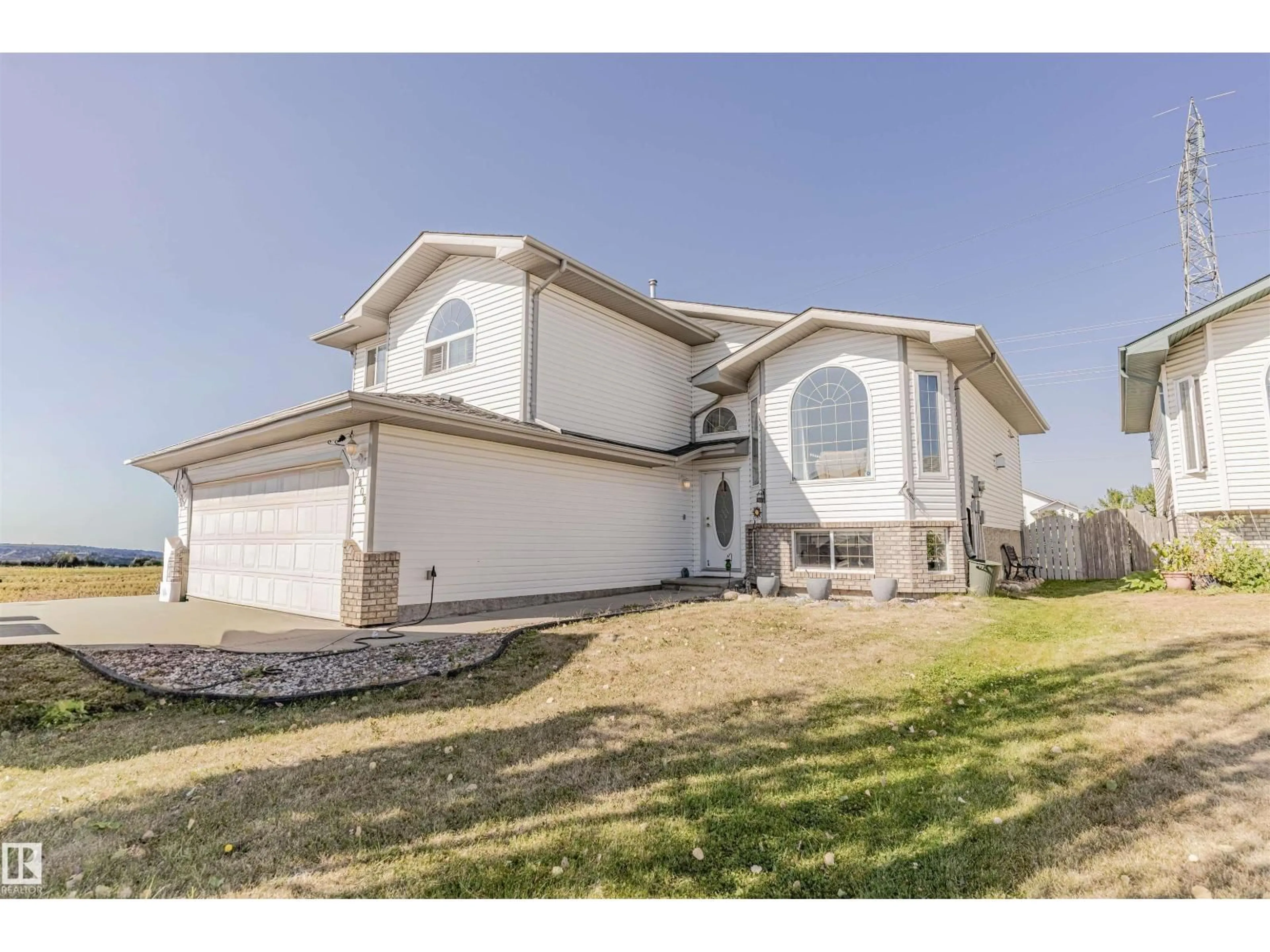 Home with vinyl exterior material, street for 7808 163 AV, Edmonton Alberta T5Z3K8