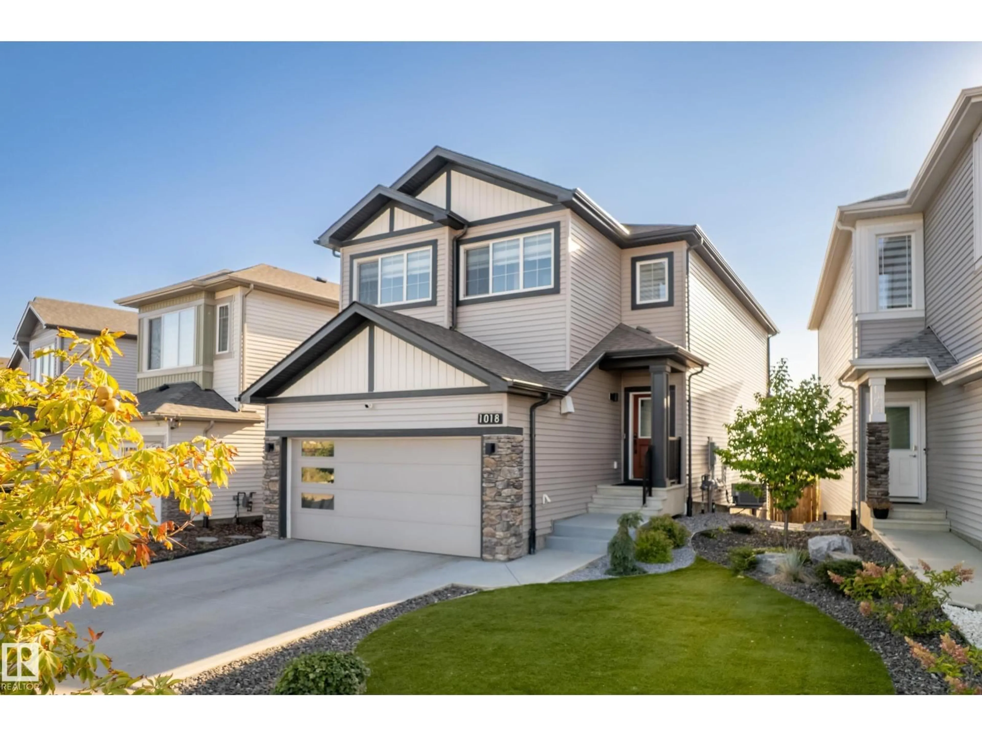 Home with vinyl exterior material, street for 1018 CY BECKER RD, Edmonton Alberta T5Y4A3