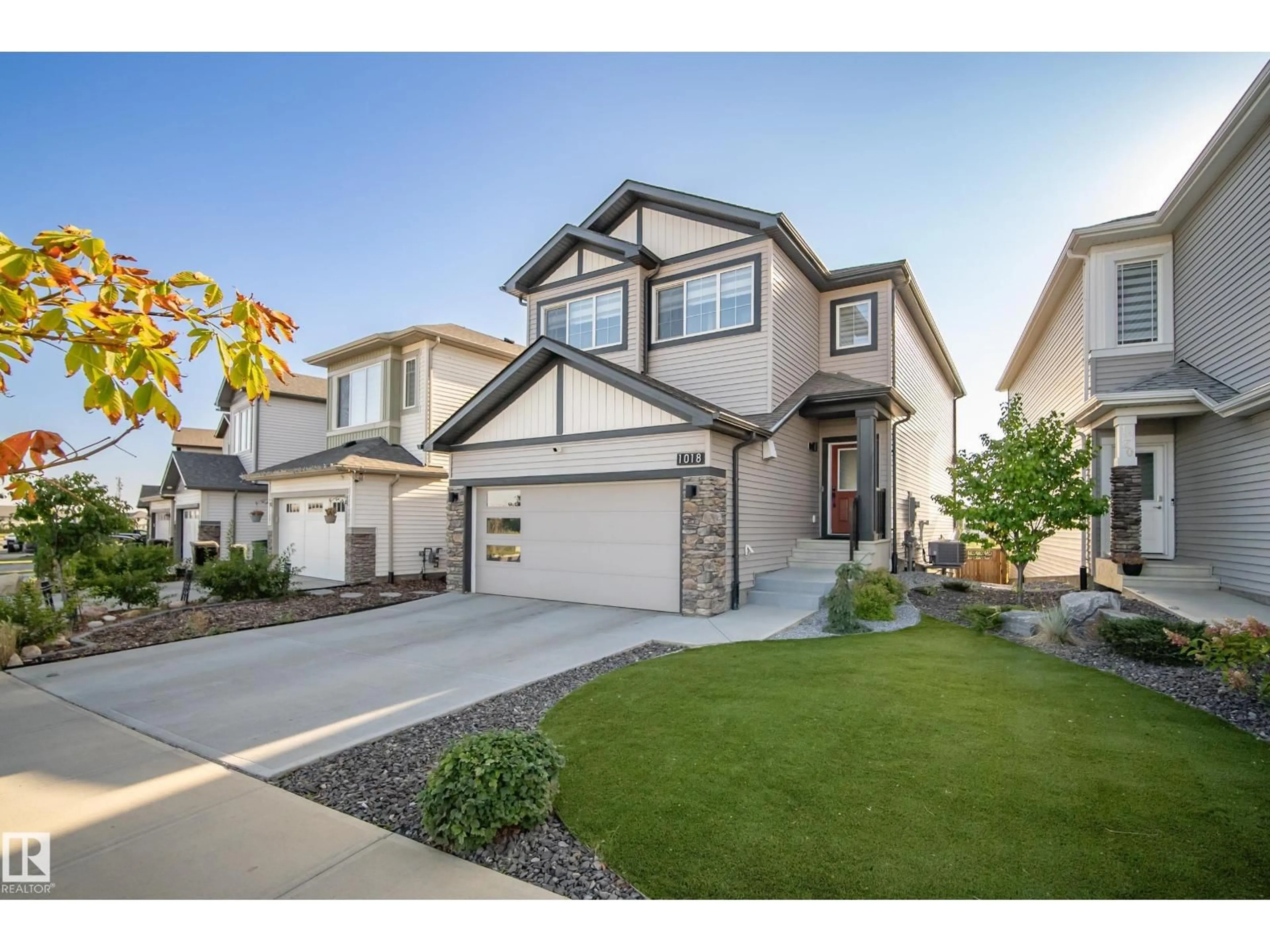 Home with vinyl exterior material, street for 1018 CY BECKER RD, Edmonton Alberta T5Y4A3