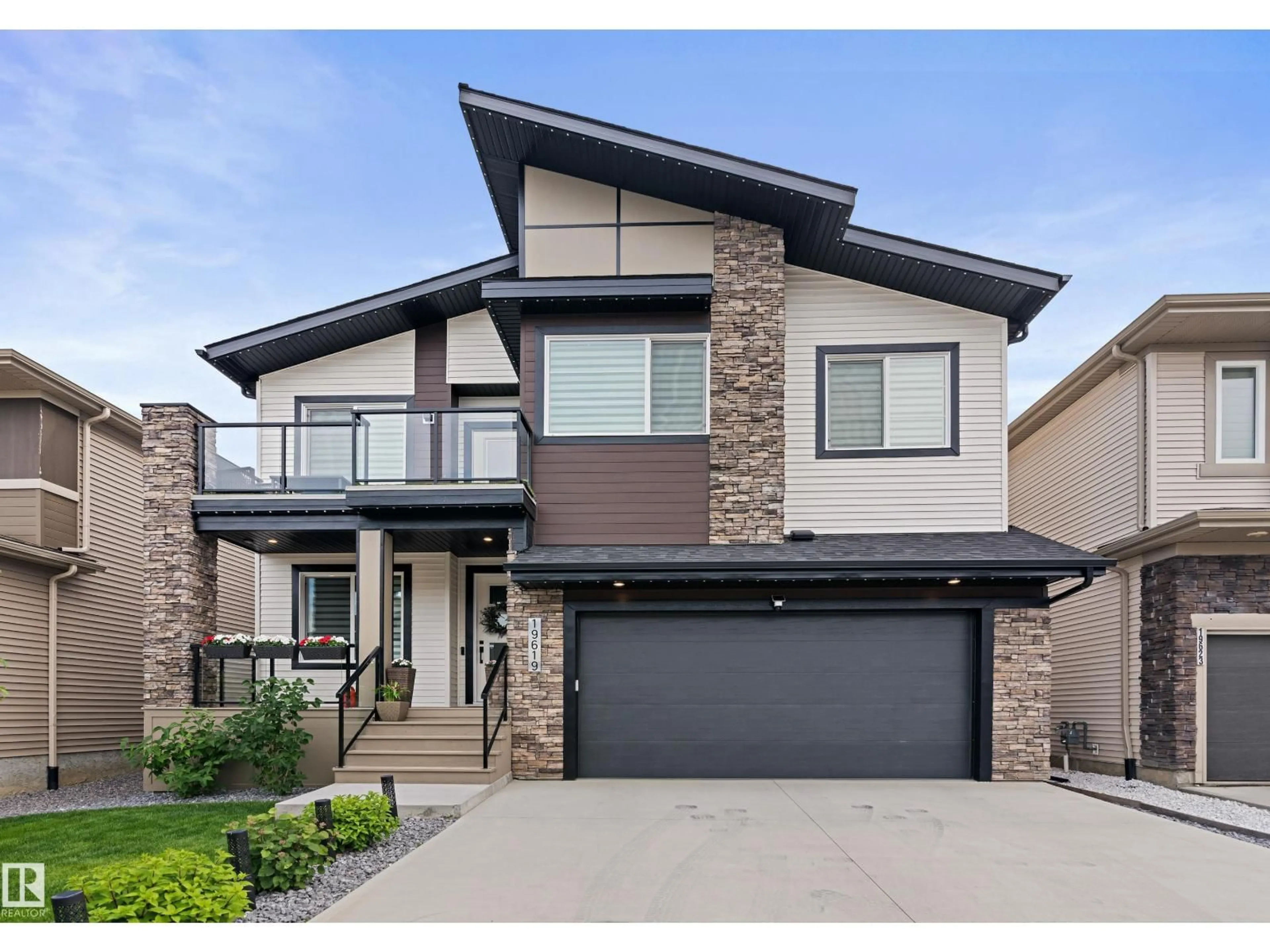 Home with brick exterior material, street for 19619 26 AV, Edmonton Alberta T6M0X4