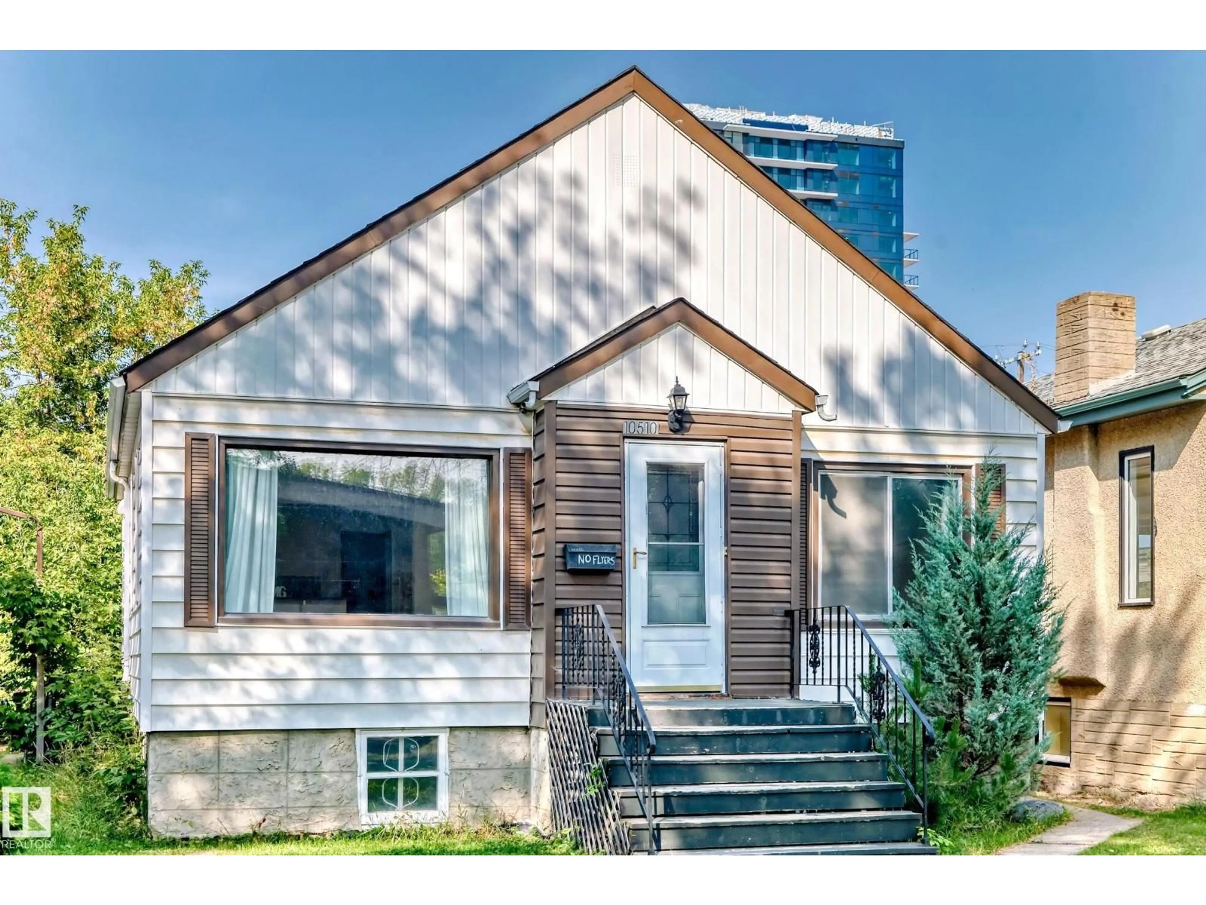 Home with vinyl exterior material, street for 10510 79 AV, Edmonton Alberta T6E1R8