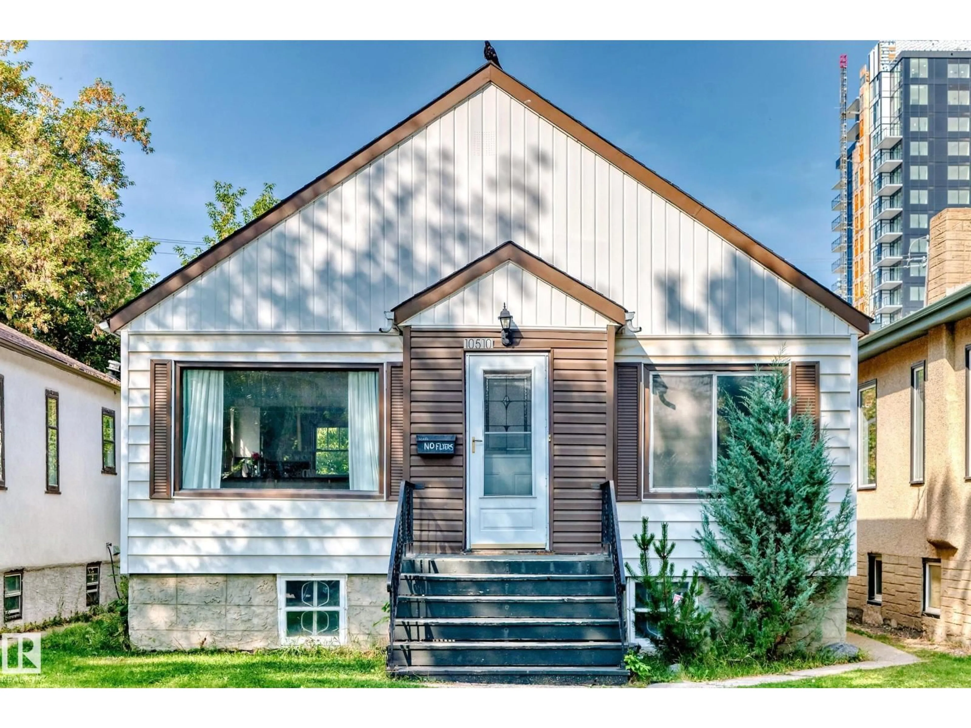 Home with vinyl exterior material, street for 10510 79 AV, Edmonton Alberta T6E1R8