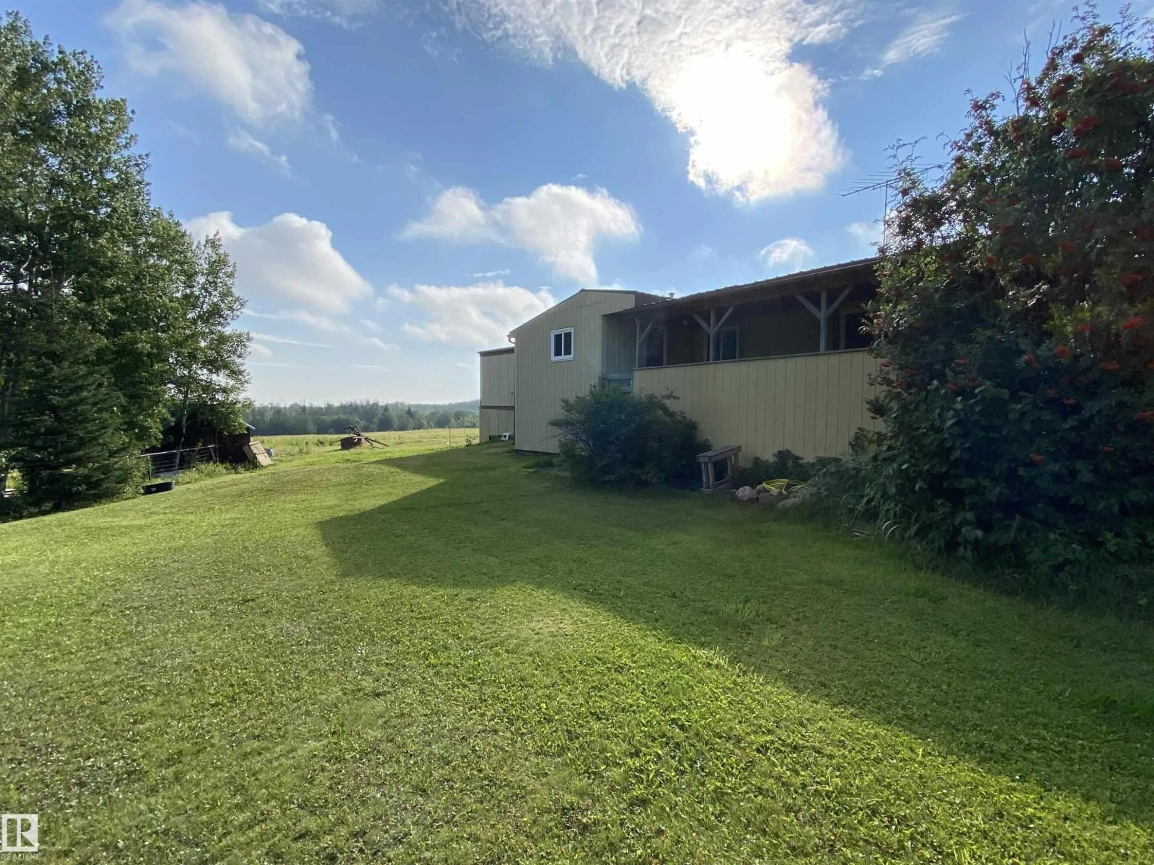 A pic from outside/outdoor area/front of a property/back of a property/a pic from drone, unknown for 465025 RR 33, Rural Wetaskiwin County Alberta T0C2X0