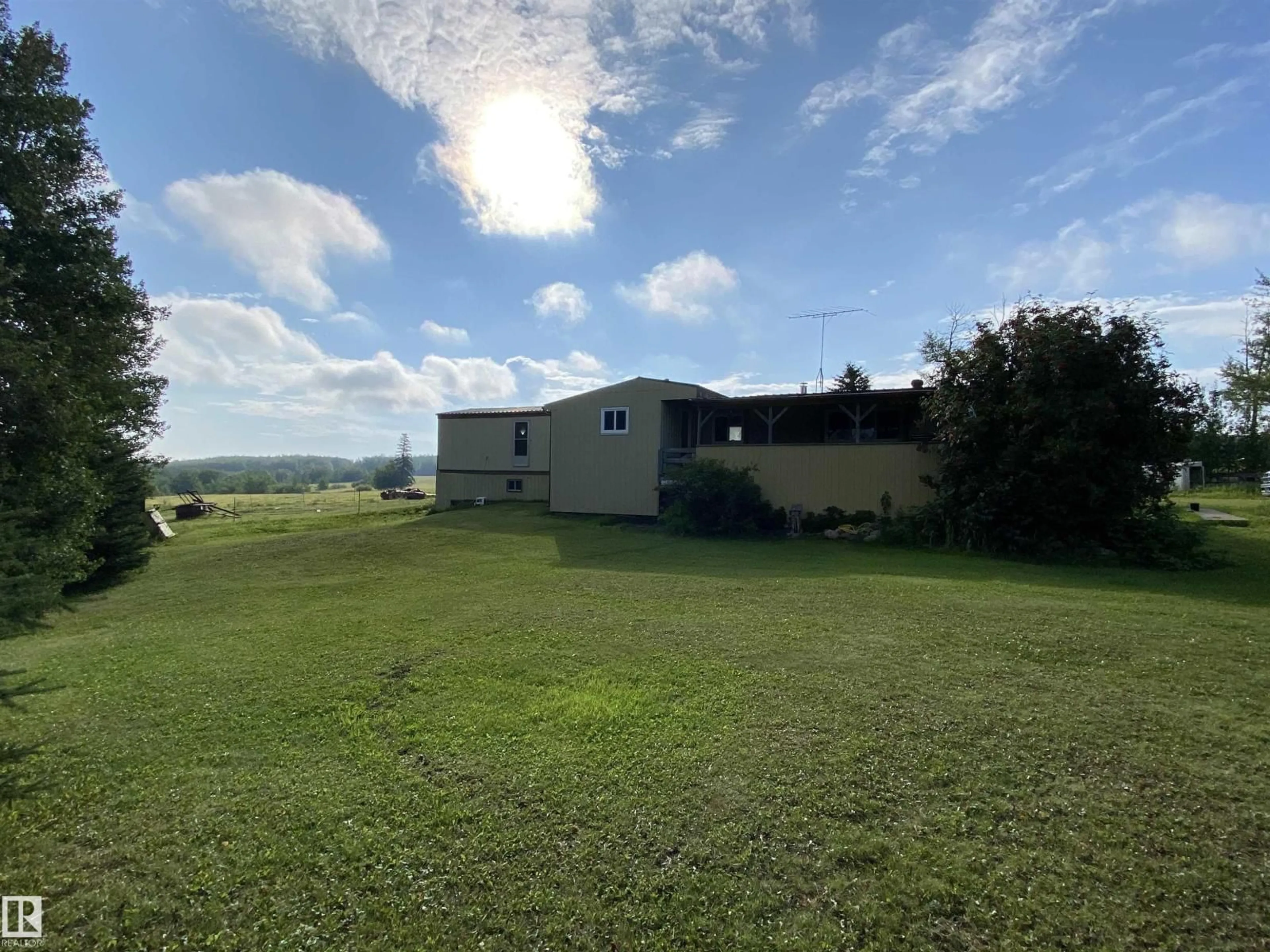 A pic from outside/outdoor area/front of a property/back of a property/a pic from drone, unknown for 465025 RR 33, Rural Wetaskiwin County Alberta T0C2X0