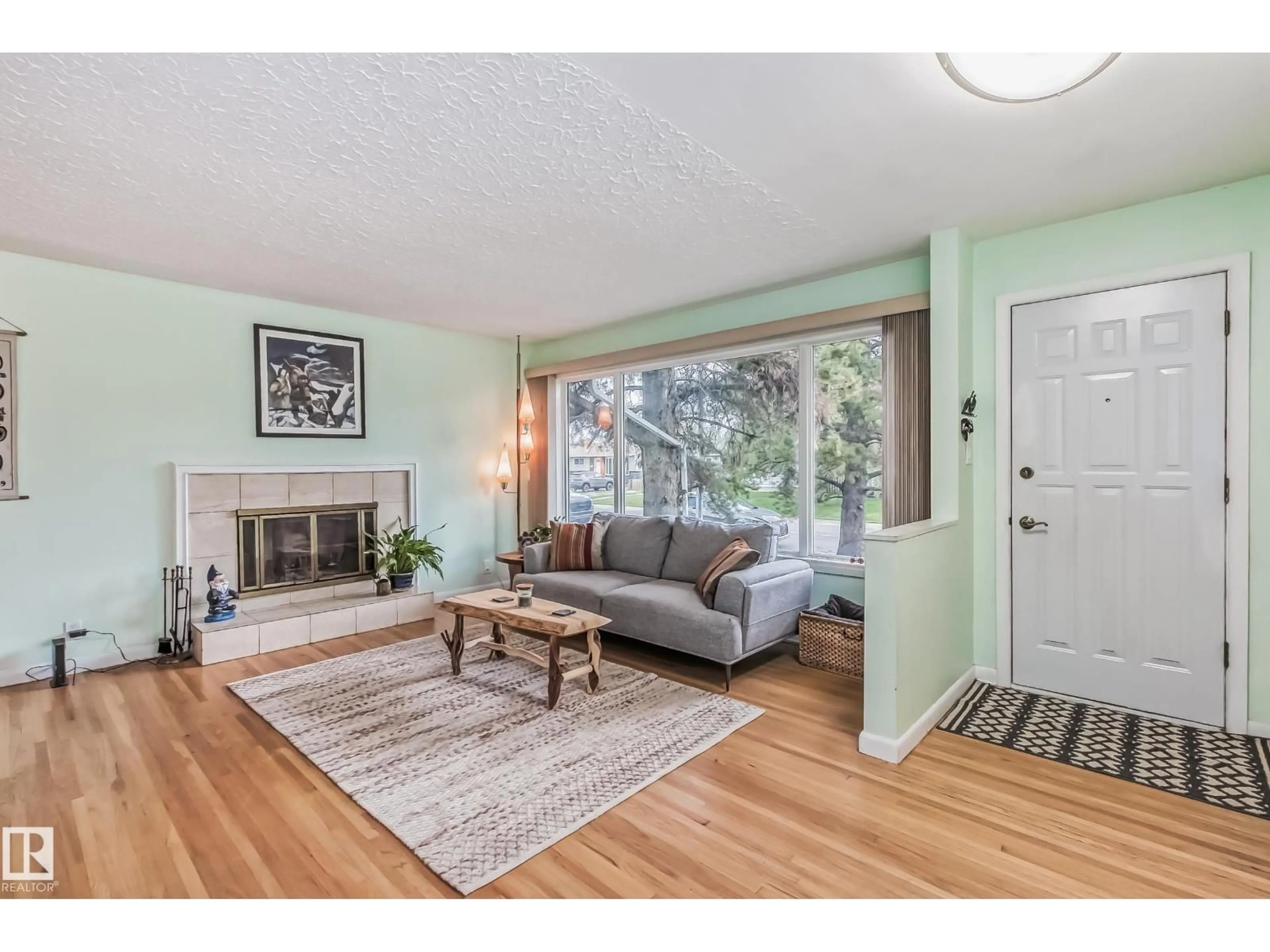 Living room with furniture, wood/laminate floor for 9210 157 ST, Edmonton Alberta T5R2B1