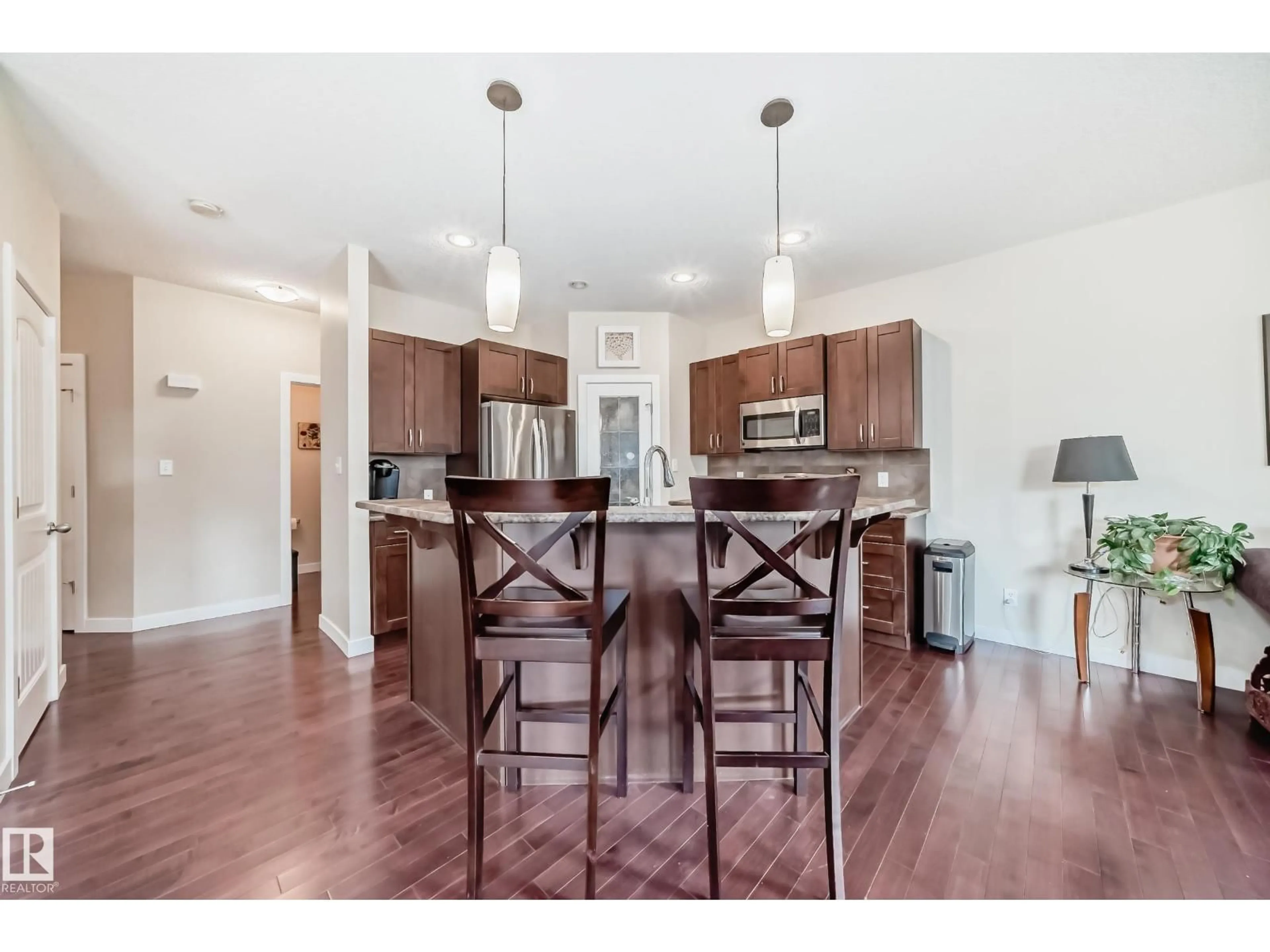 Open concept kitchen, wood/laminate floor for 29 HERON CR, Spruce Grove Alberta T7X0G1