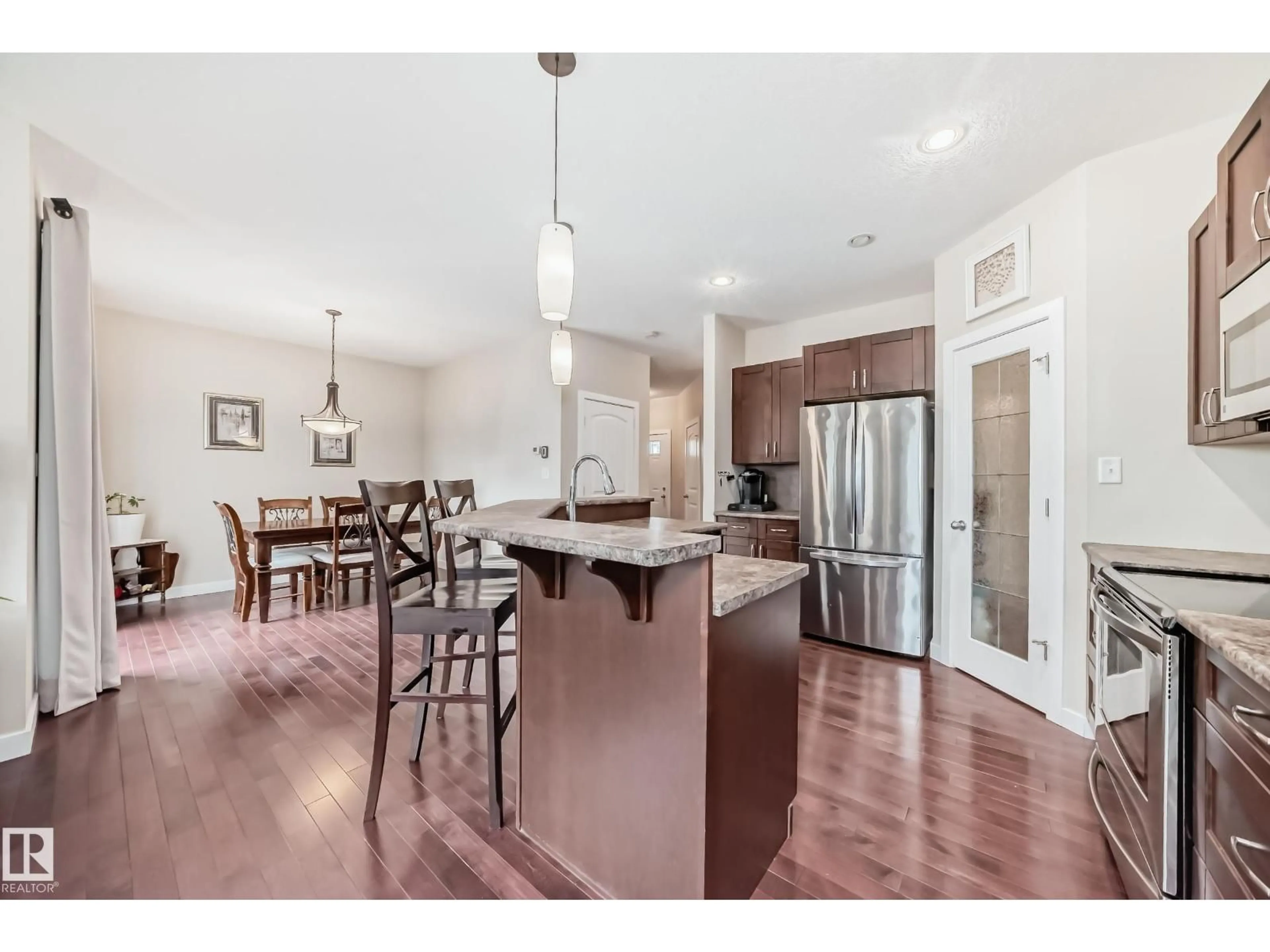 Open concept kitchen, wood/laminate floor for 29 HERON CR, Spruce Grove Alberta T7X0G1