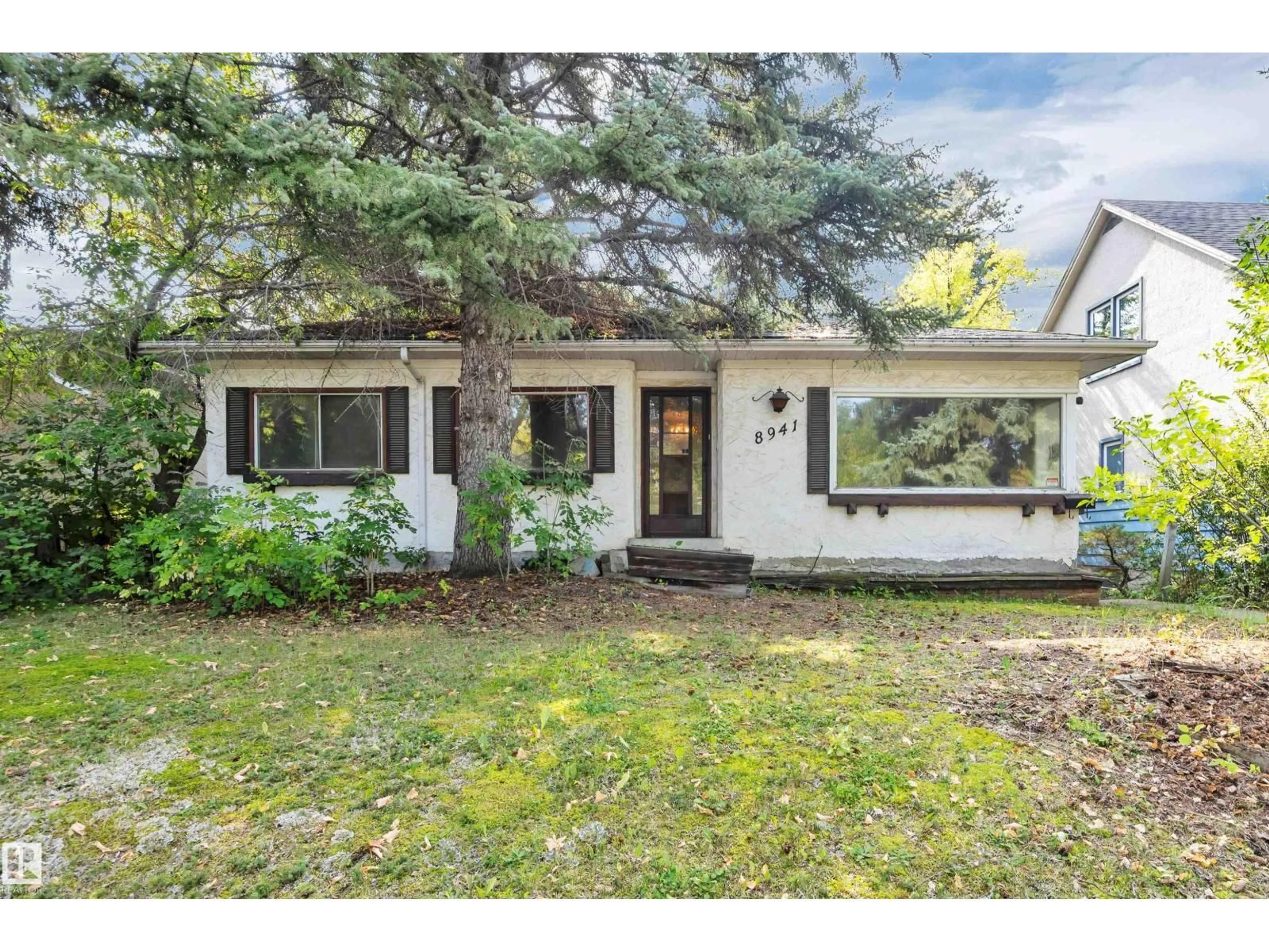 Home with vinyl exterior material, street for 8941 79 AV, Edmonton Alberta T6C0R7
