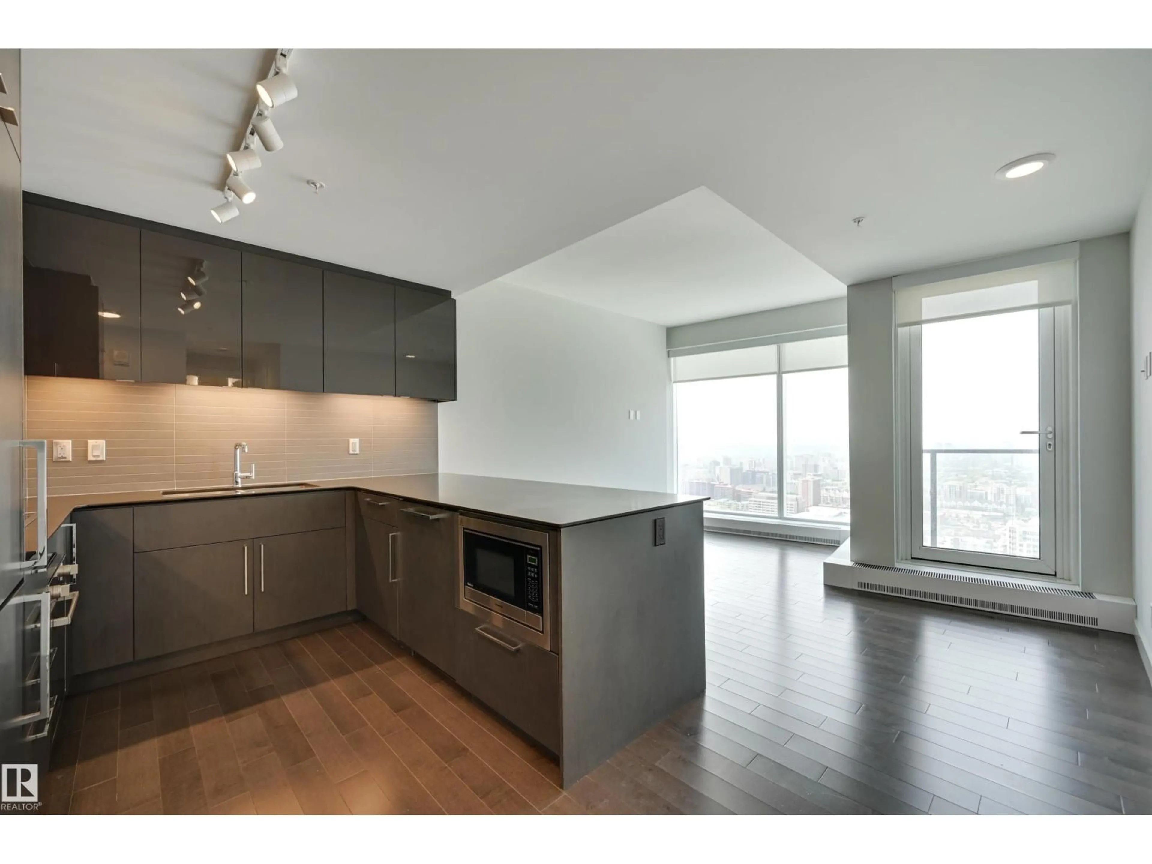 Open concept kitchen, wood/laminate floor for 10360 - 3412 102 ST, Edmonton Alberta T5J0K6