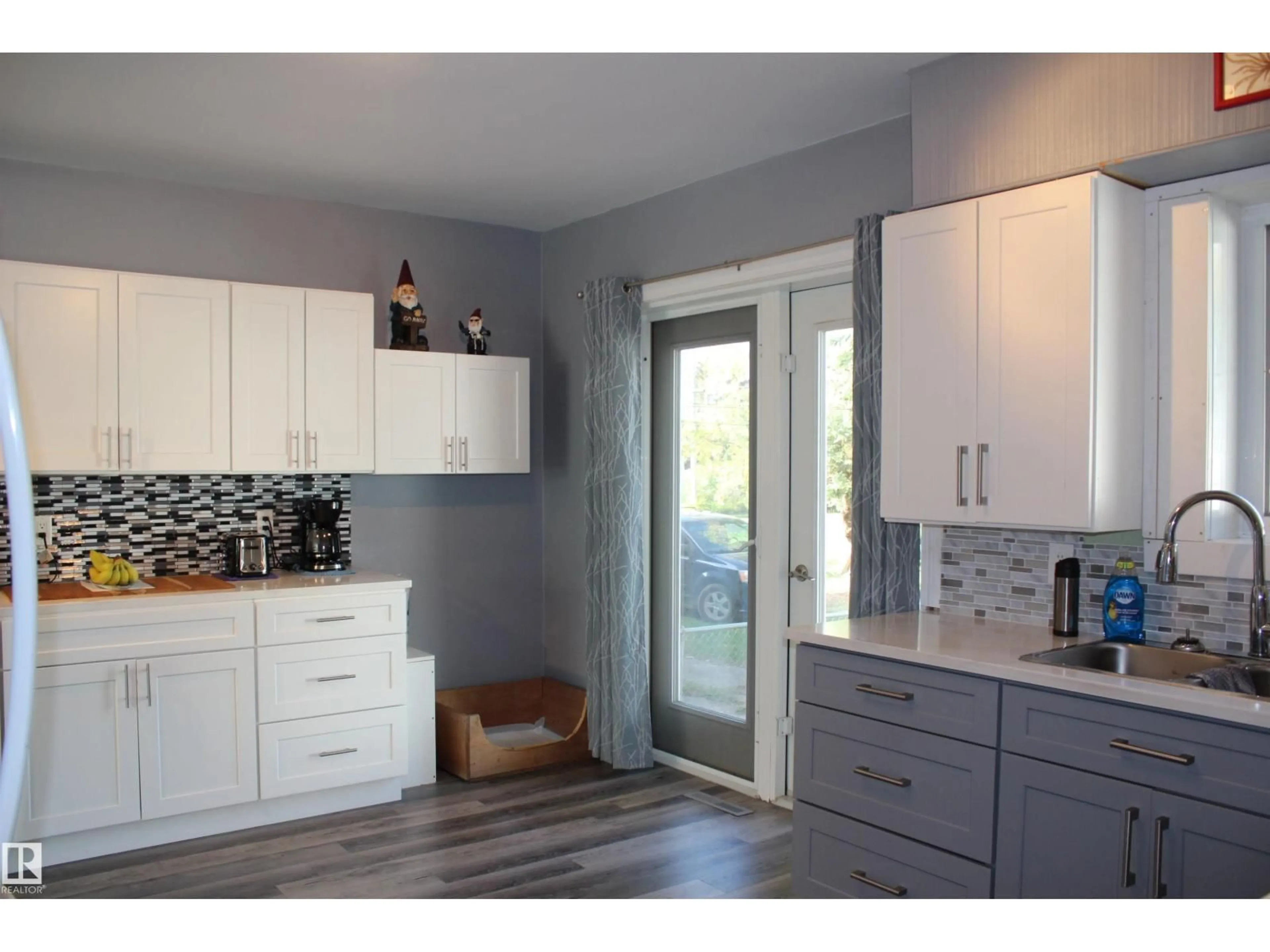 Open concept kitchen, wood/laminate floor for 5136 51 AV, Mundare Alberta T0B3H0
