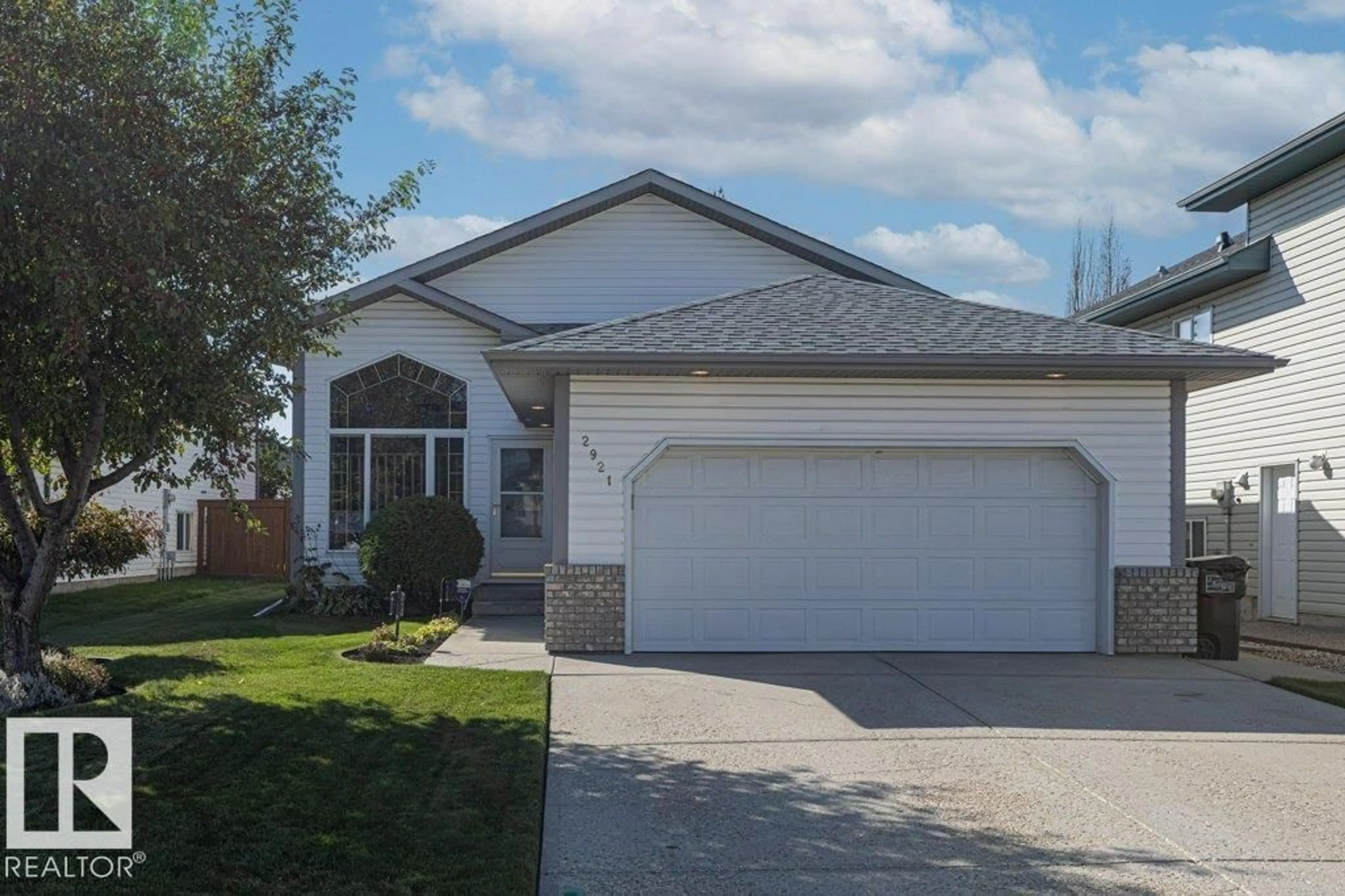 Home with vinyl exterior material, street for 2921 152 AV, Edmonton Alberta T5Y2Y4