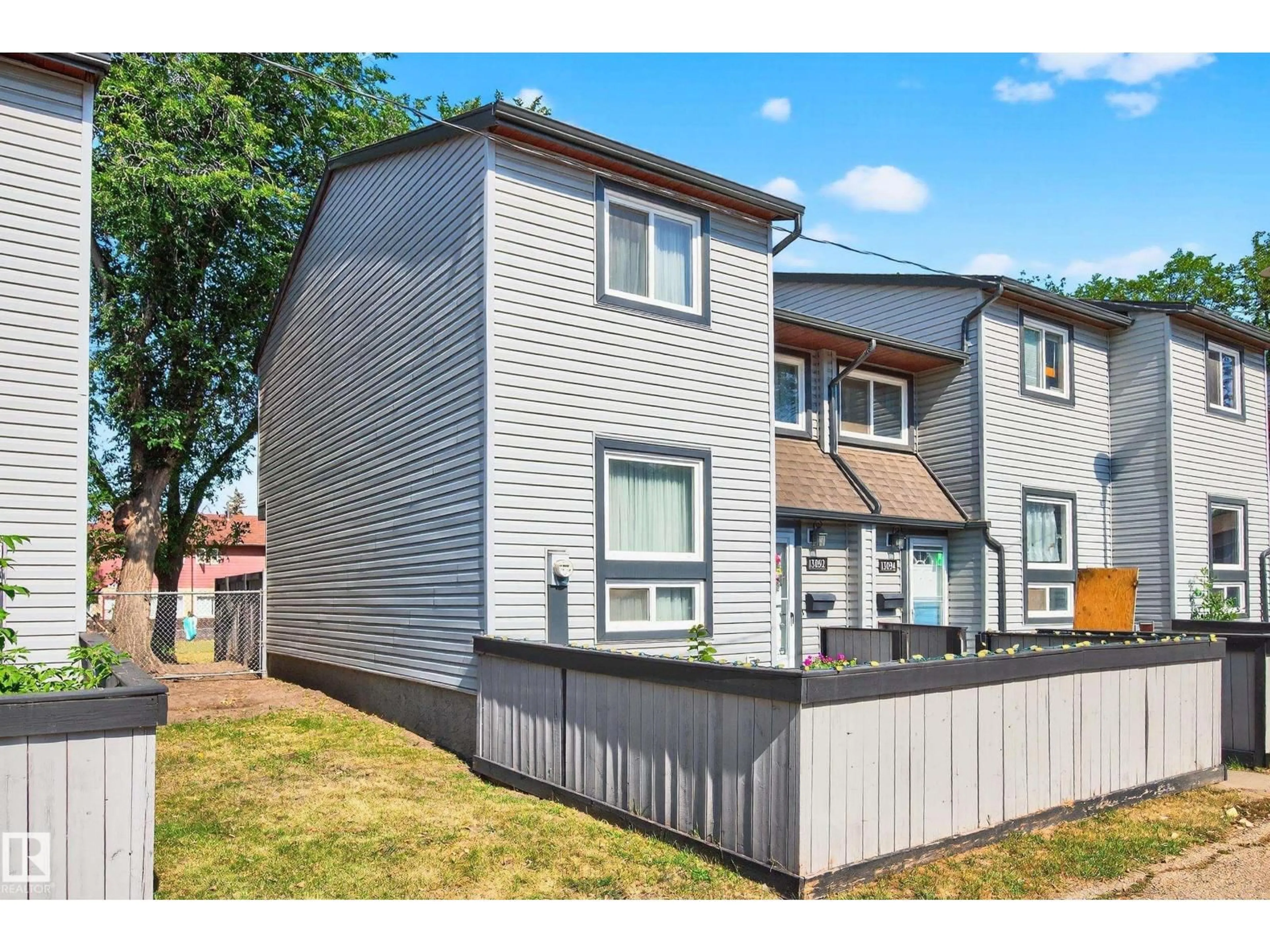 Home with vinyl exterior material, street for NW - 13892 24 ST, Edmonton Alberta T5Y1B6