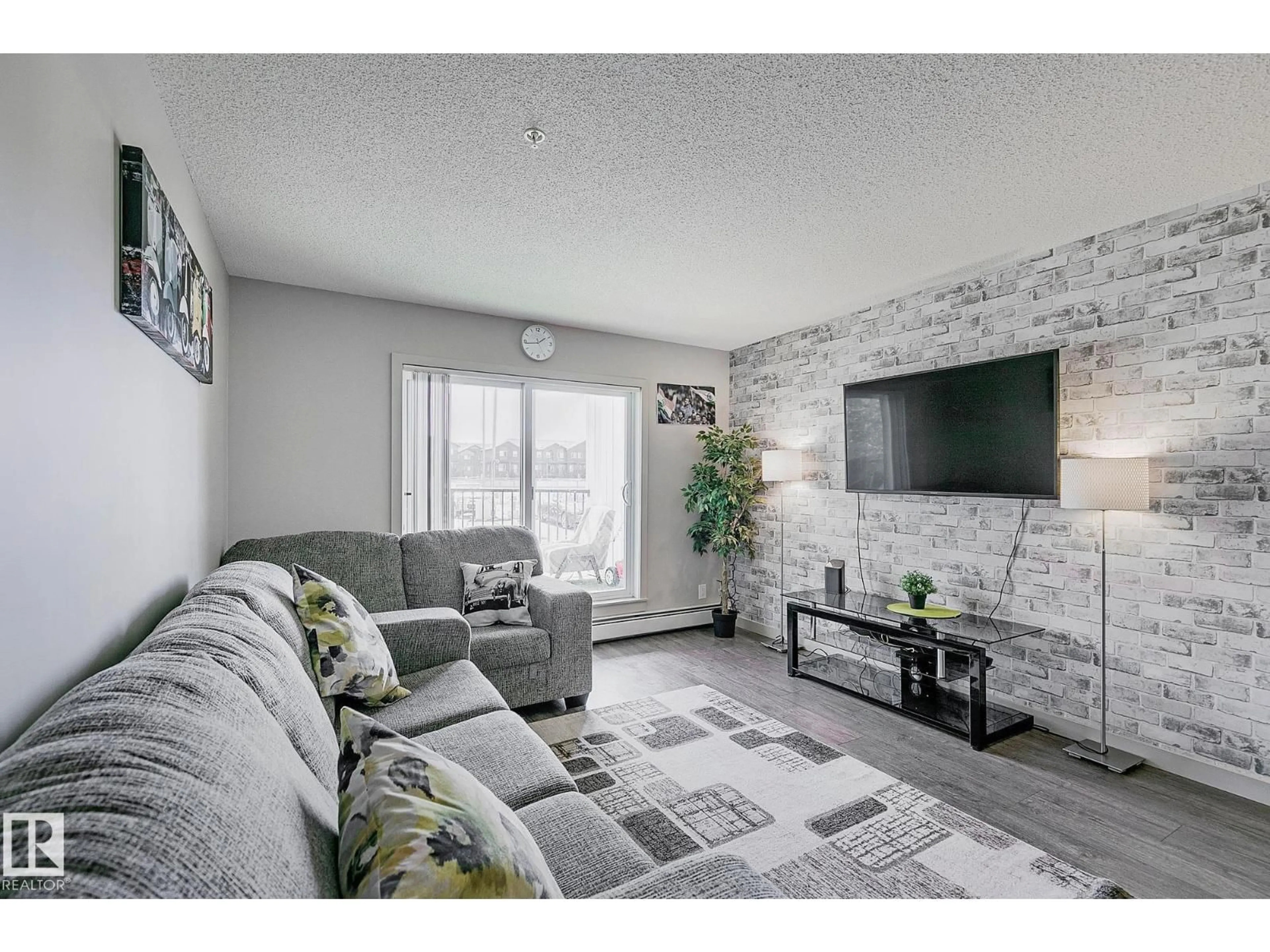 Living room with furniture, unknown for #104 - 4008 SAVARYN DR, Edmonton Alberta T6X2E5