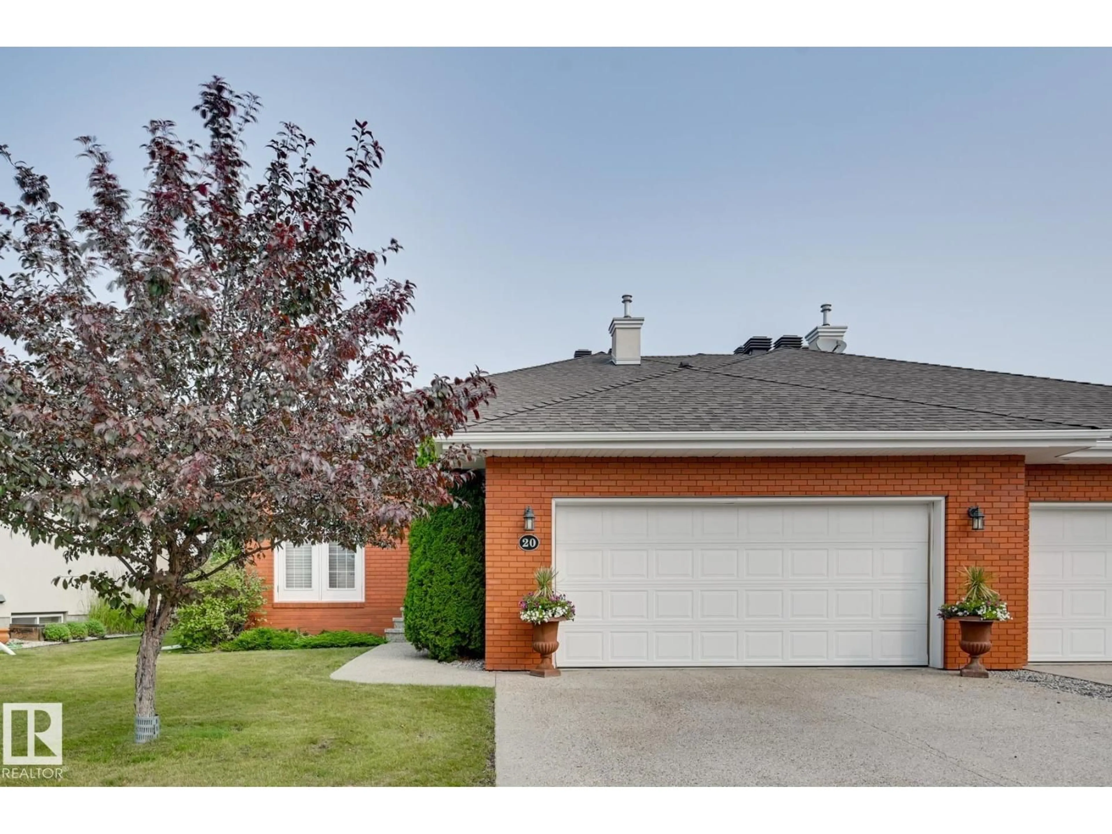 Home with brick exterior material, street for 1225 - 20 WANYANDI RD, Edmonton Alberta T6M2W7