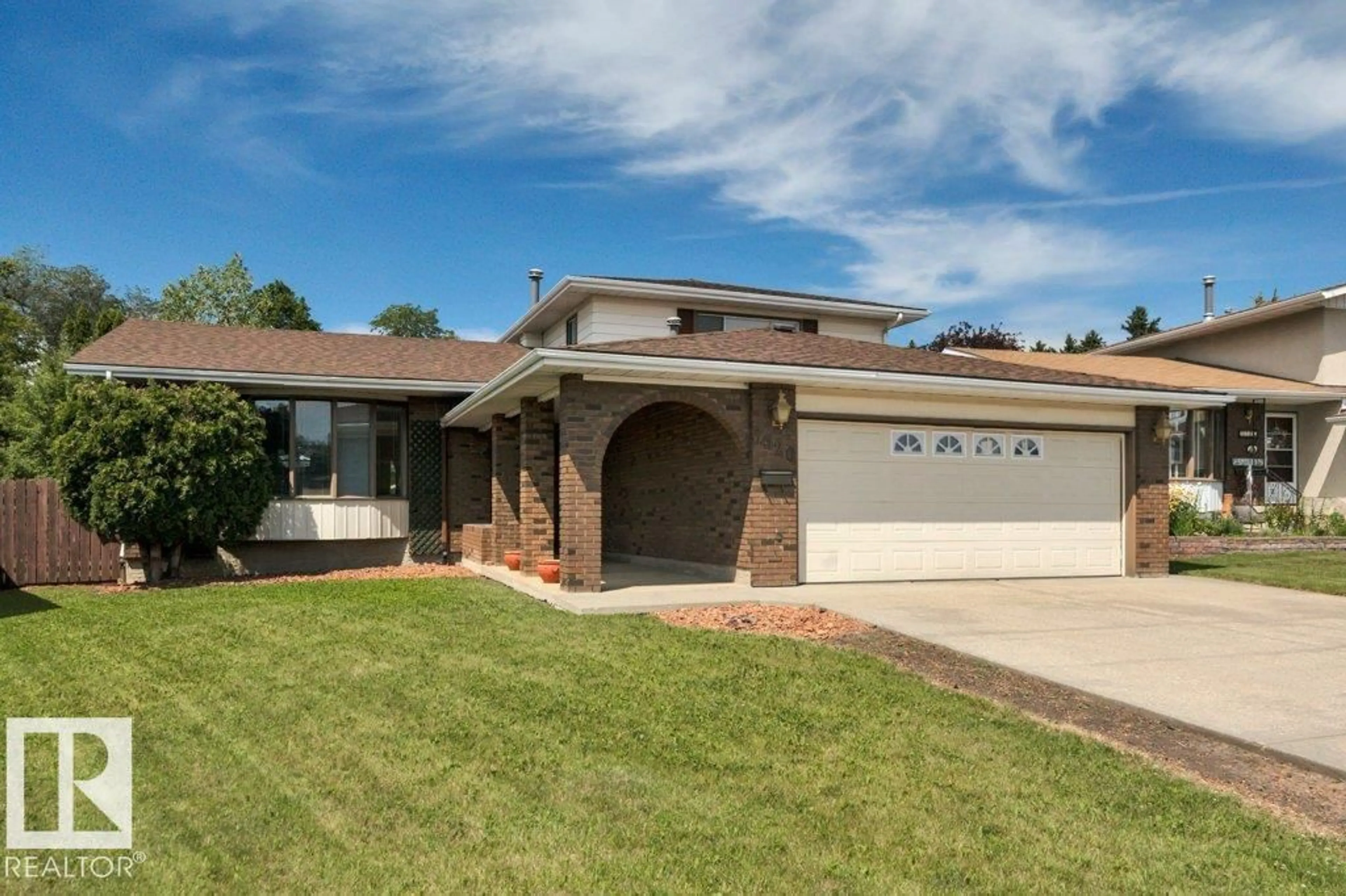 Home with brick exterior material, street for 3520 103 AV, Edmonton Alberta T5W0A7