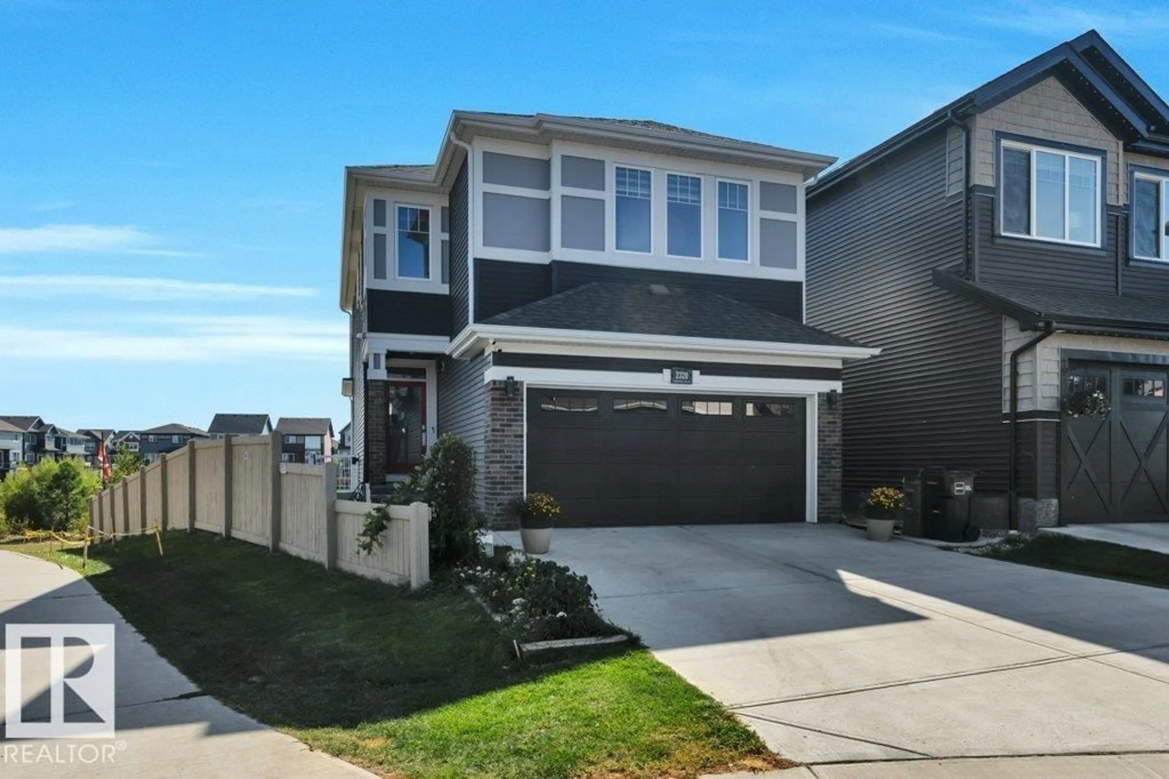 Home with vinyl exterior material, street for SW - 2320 CHOKECHERRY CL, Edmonton Alberta T6X2M7