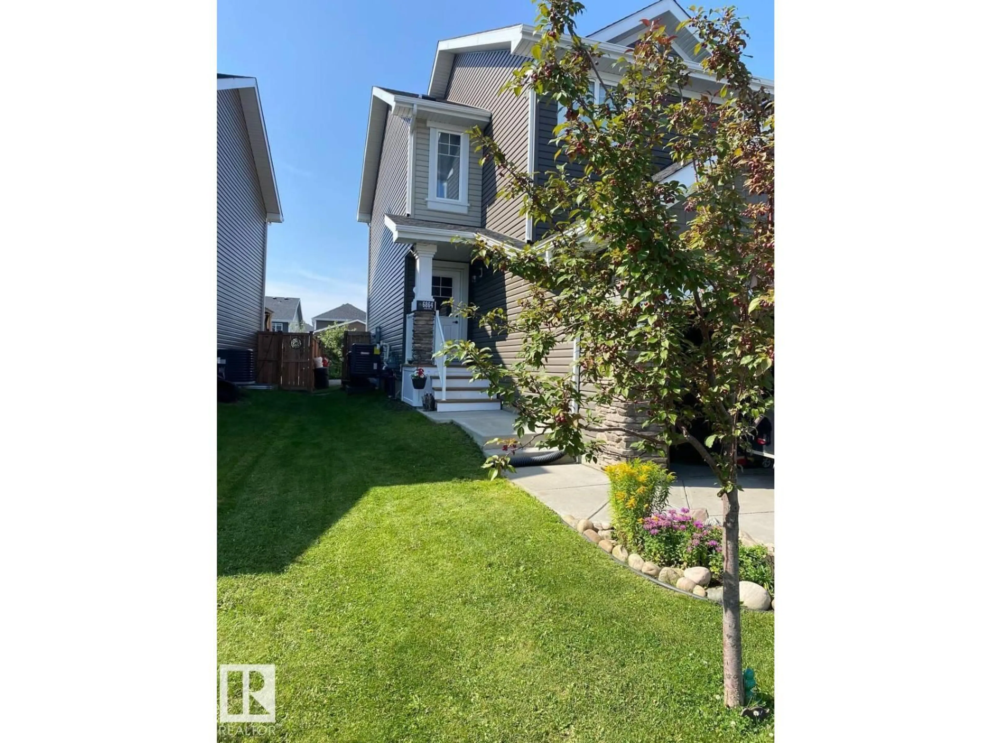 A pic from outside/outdoor area/front of a property/back of a property/a pic from drone, street for 6864 EVANS WD, Edmonton Alberta T6M0T6