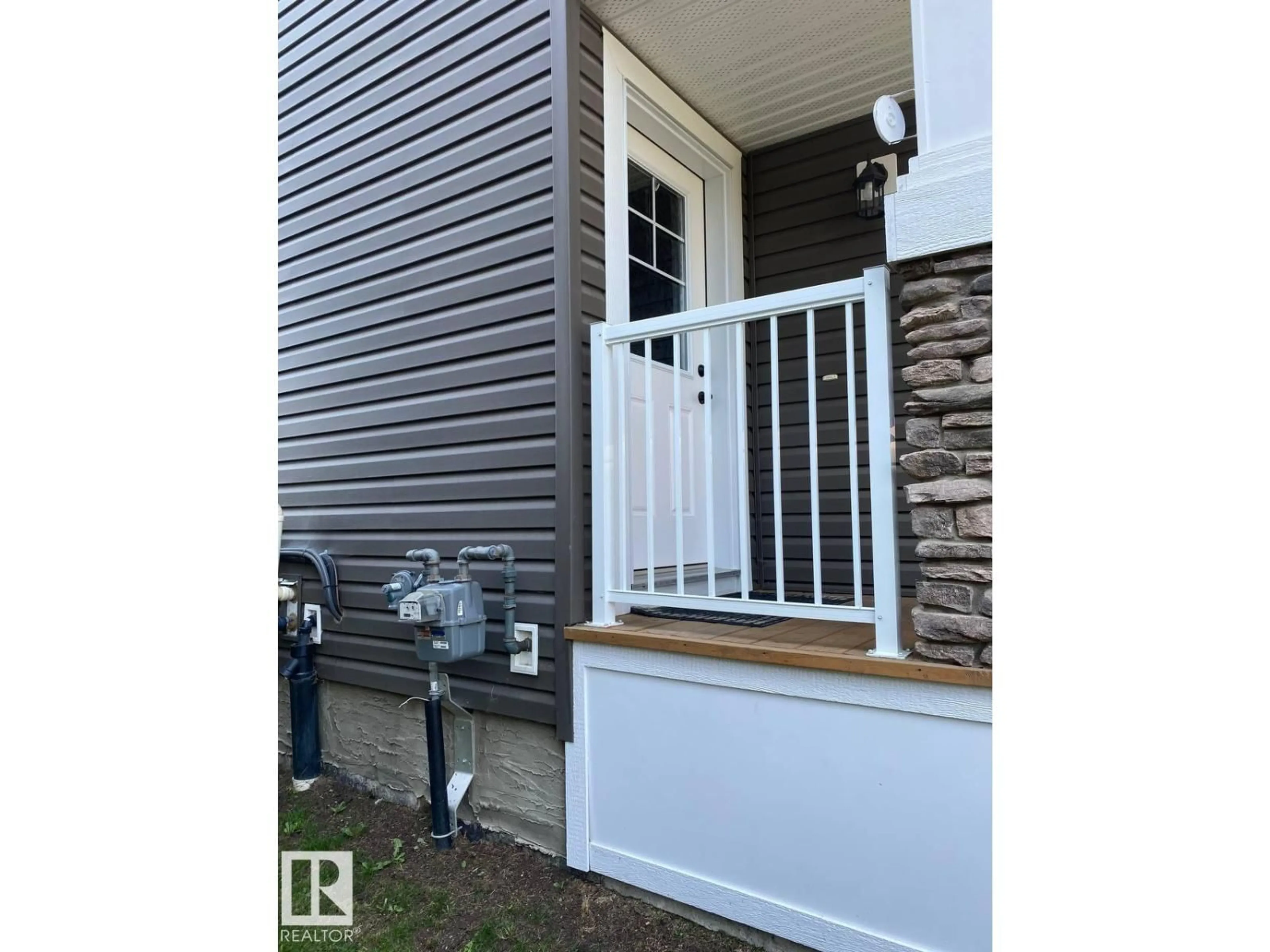 Home with vinyl exterior material, street for 6864 EVANS WD, Edmonton Alberta T6M0T6