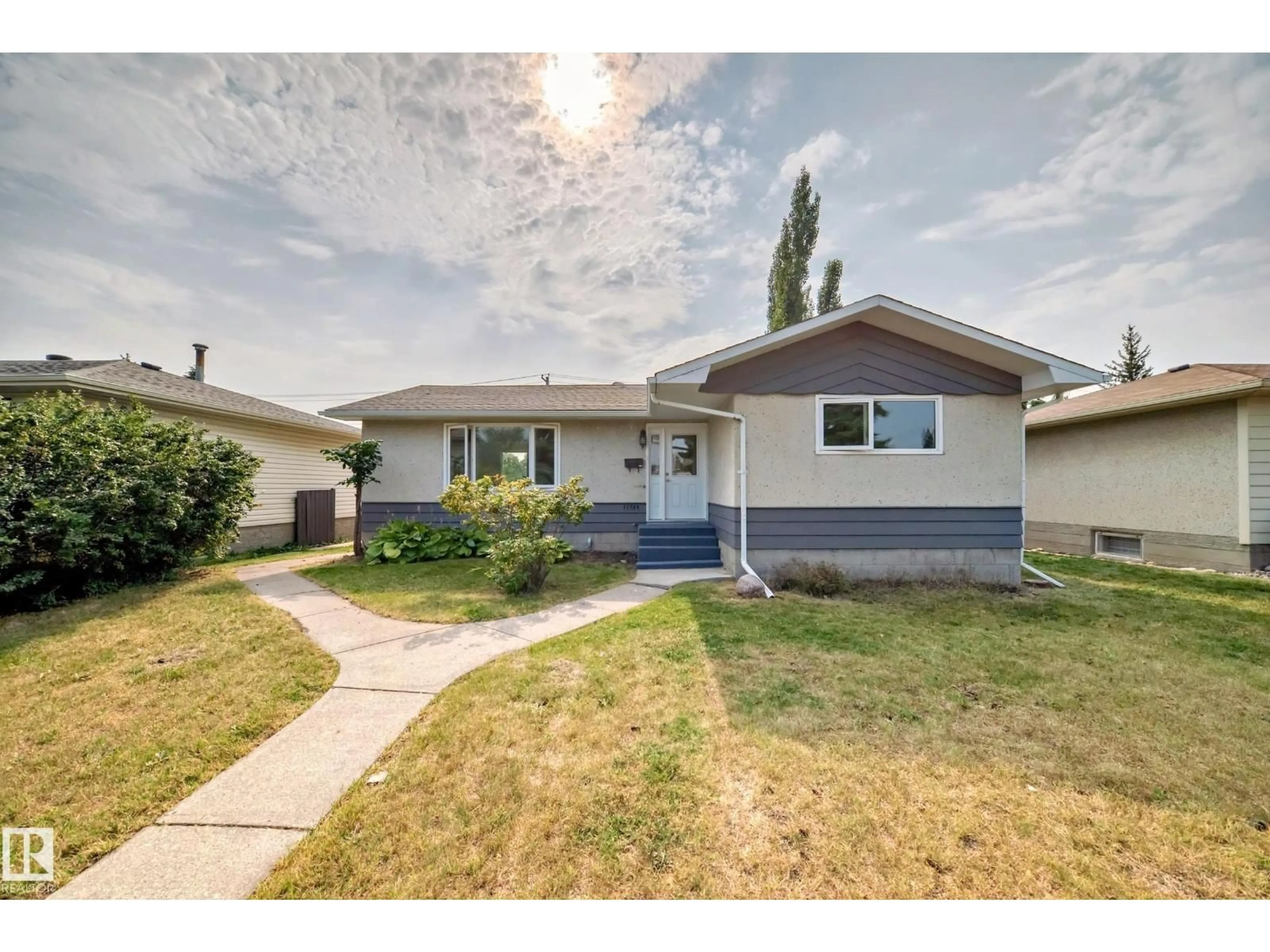 Home with vinyl exterior material, street for 11707 46 AV, Edmonton Alberta T6H0A6
