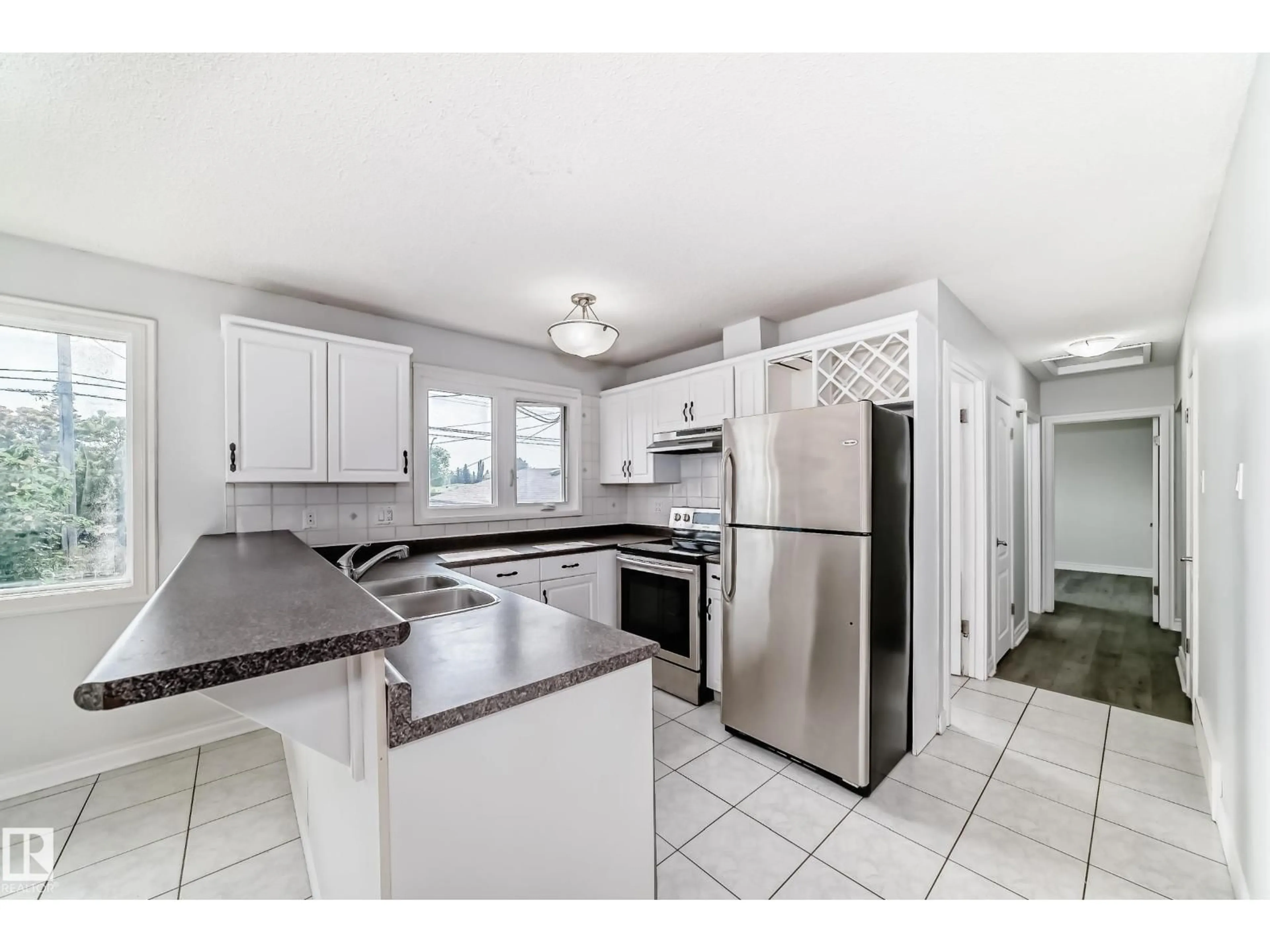 Open concept kitchen, ceramic/tile floor for 11707 46 AV, Edmonton Alberta T6H0A6